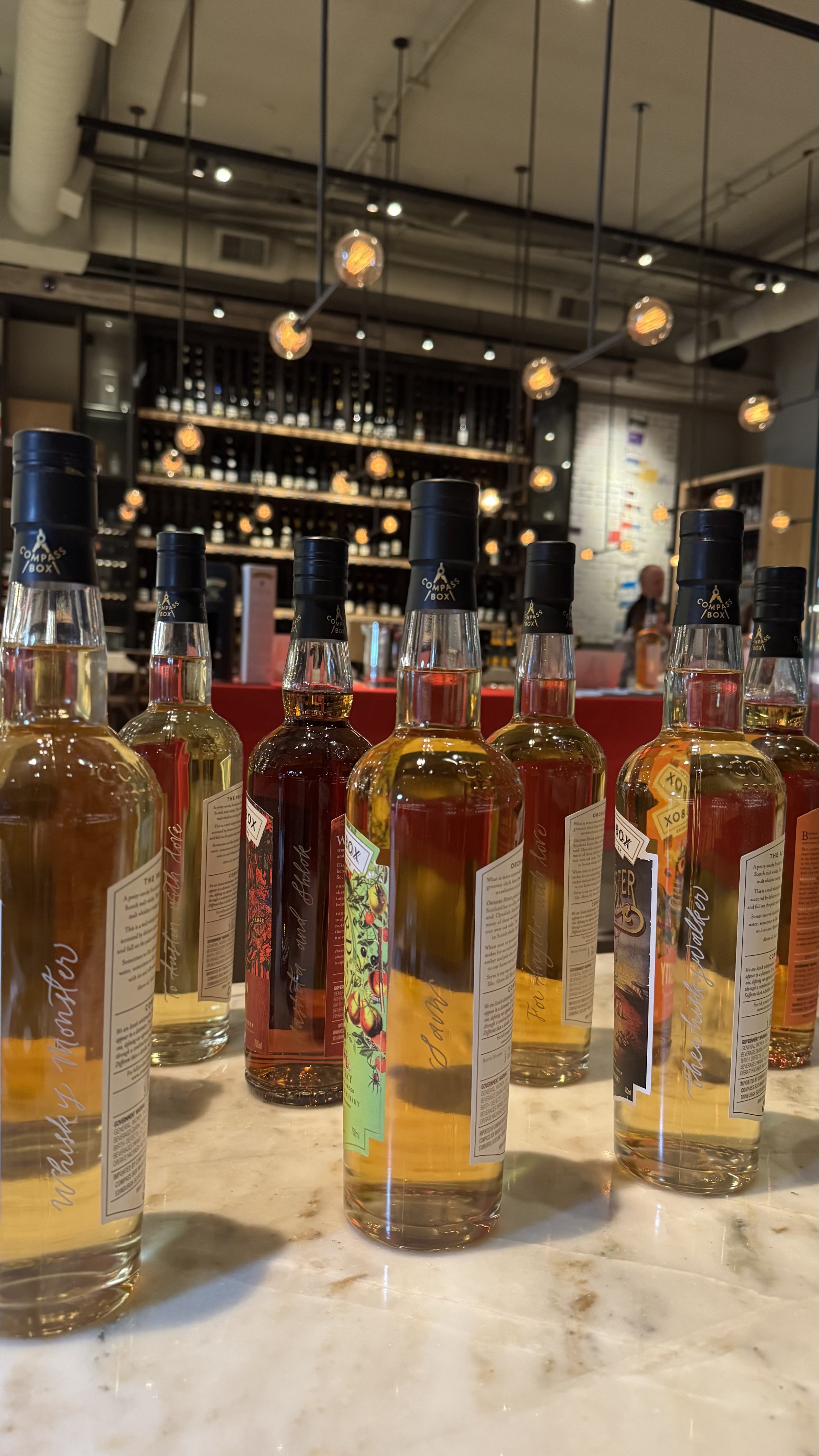 Whiskey Engraving Brand Activation for Compass Box Whisky Tasting Event for Influencers Los Angeles Wallys Santa Monica Engraving Calligraphy Artist Stacy Shon Live Event Engraver Bottle.jpeg
