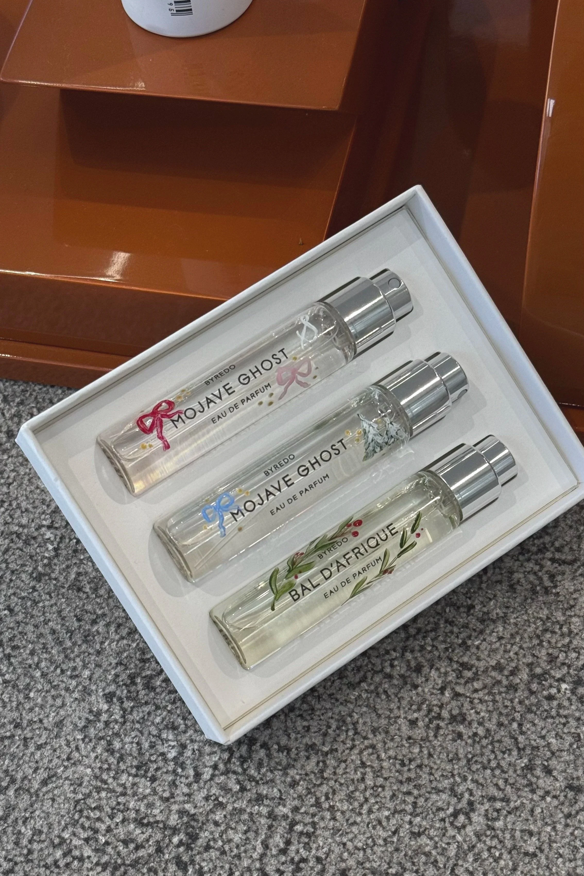 Byredo perfume bottles hand painted for in store retail activation.