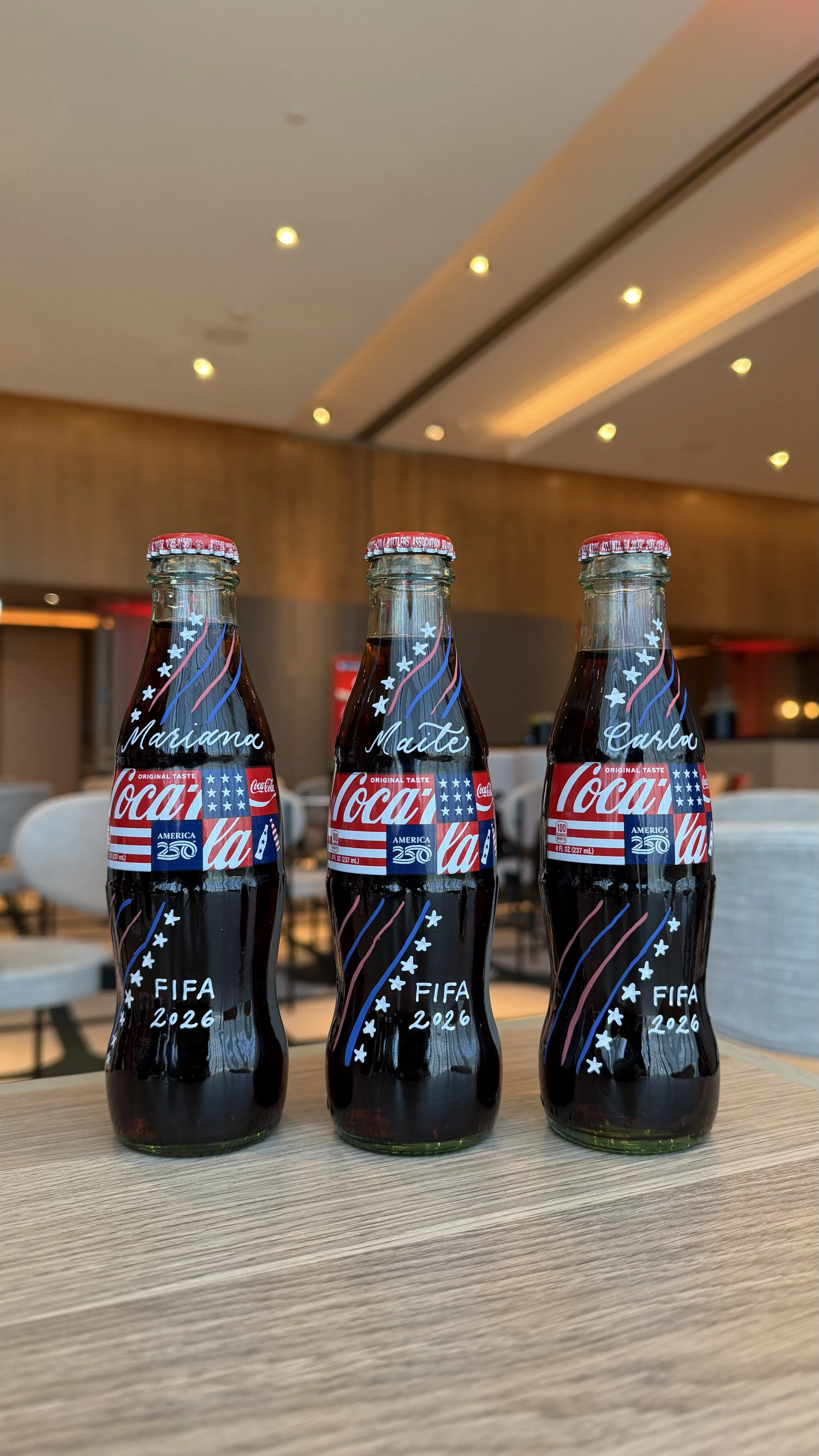 Coca Cola x FIFA World Cup activation in Los Angeles, CA - Hand calligraphy on limited edition Coca Cola bottles for guests in the Hospitality Lounge
