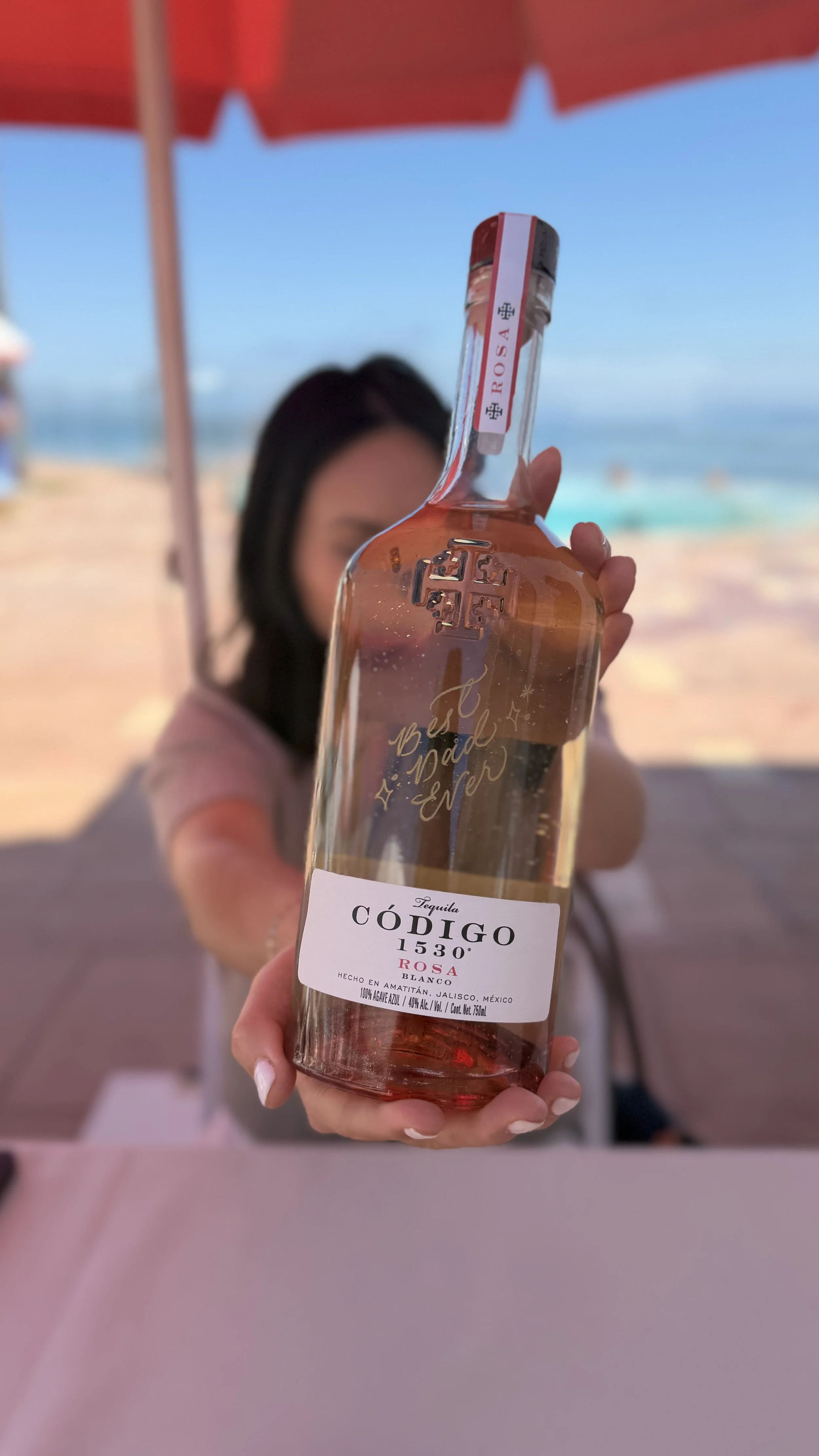 Live engraving on Codigo tequila bottles for Father's Day in Montecito, CA at Coral Casino private club