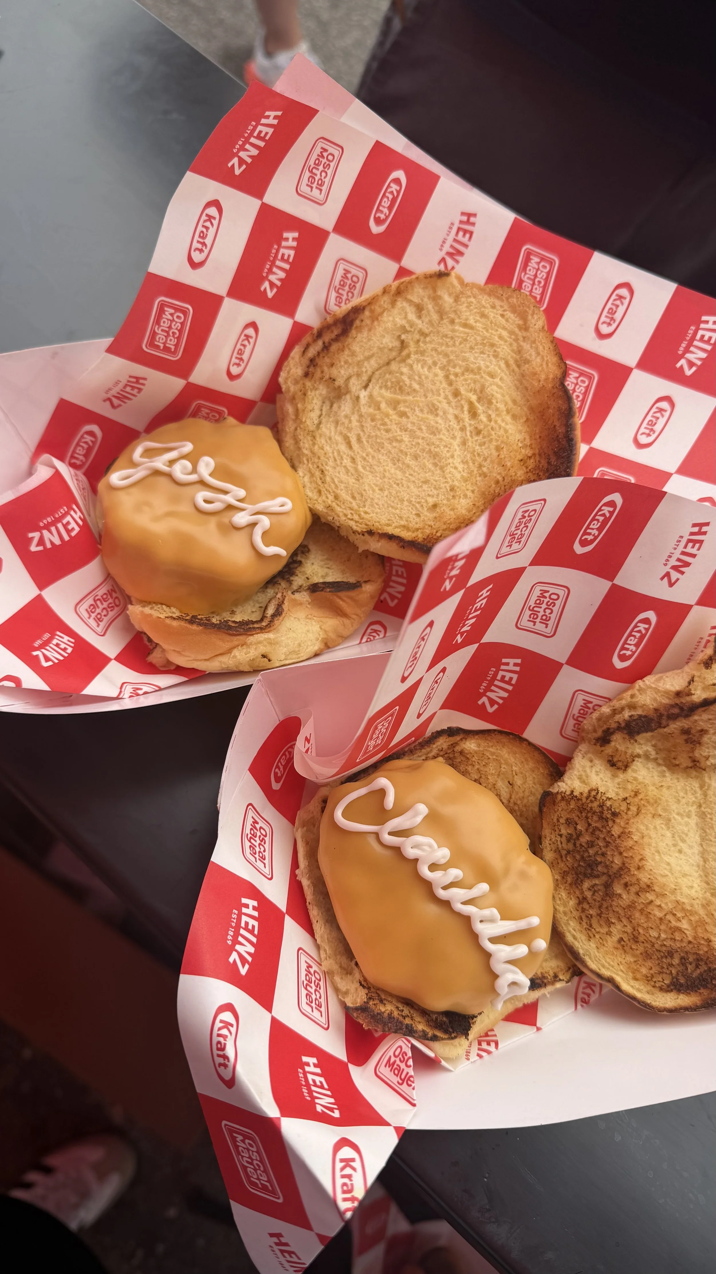 Heinz food calligraphy using mayo on cheeseburgers for guests at the America250 event at the Coliseum in Los Angeles, CA