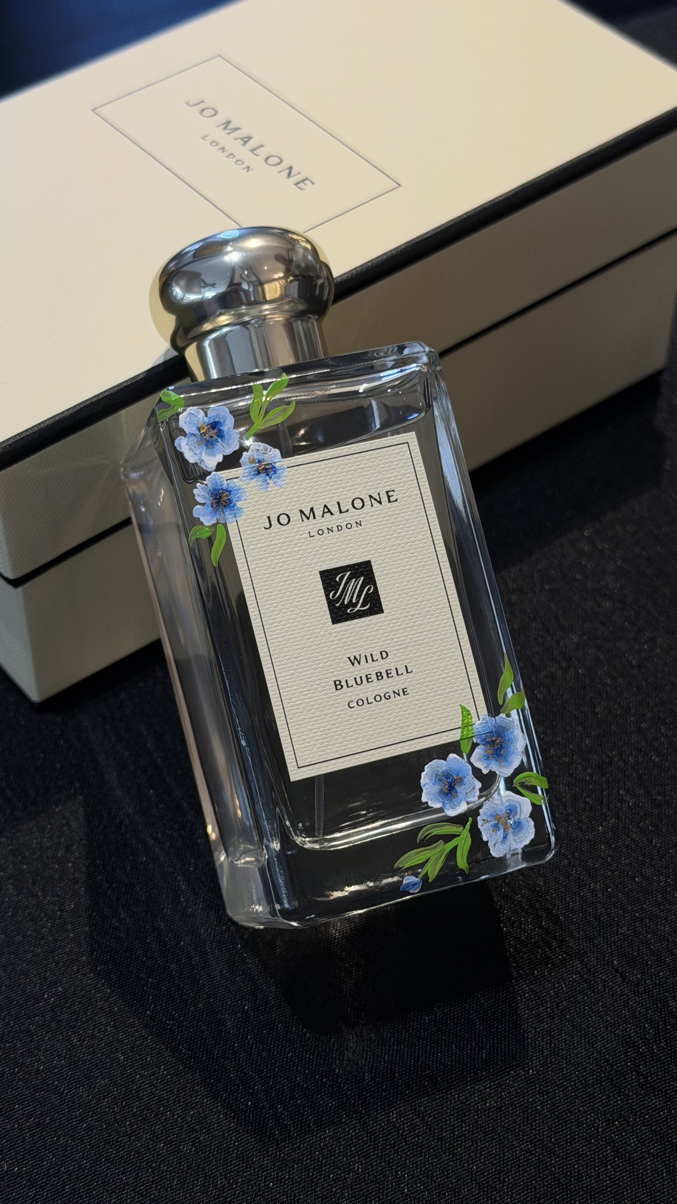 Blue florals painting on this fragrance bottle for a customer in Century City, CA