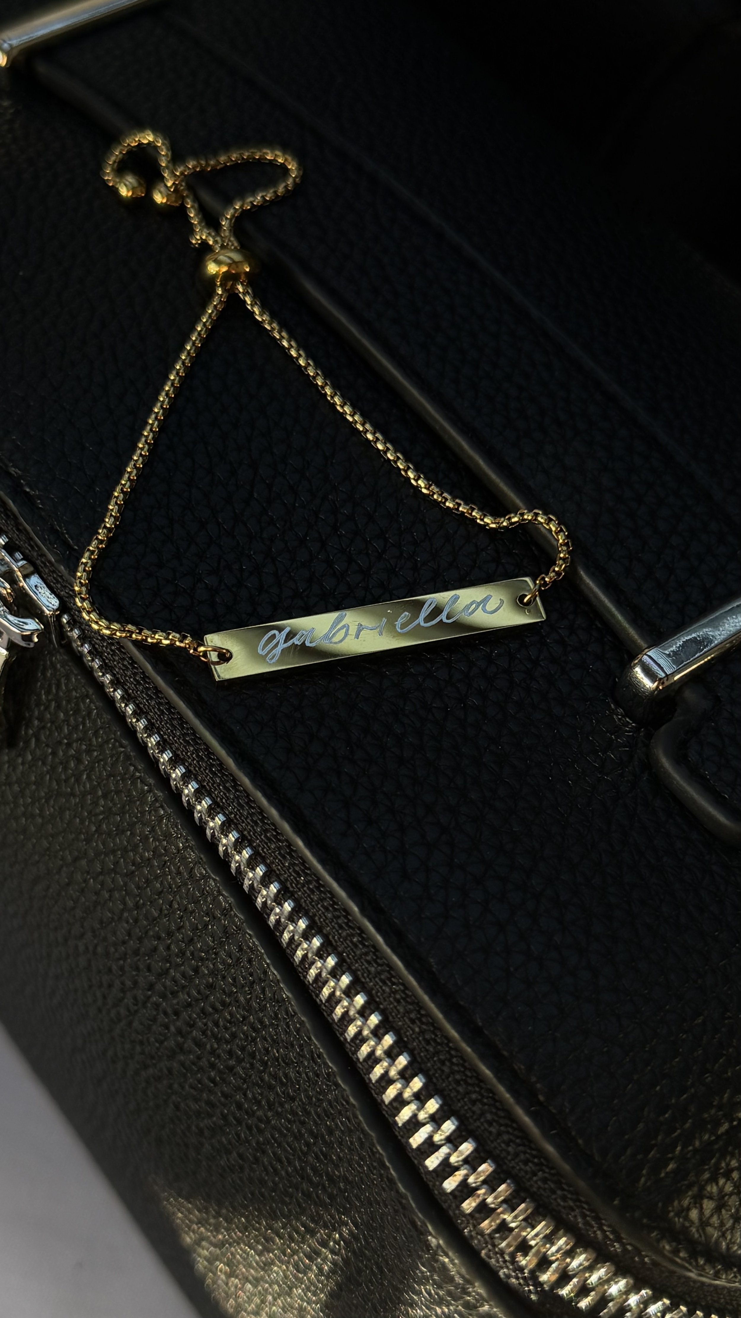 Live engraving on bar necklaces for guests attending a private event in Beverly Hills, CA