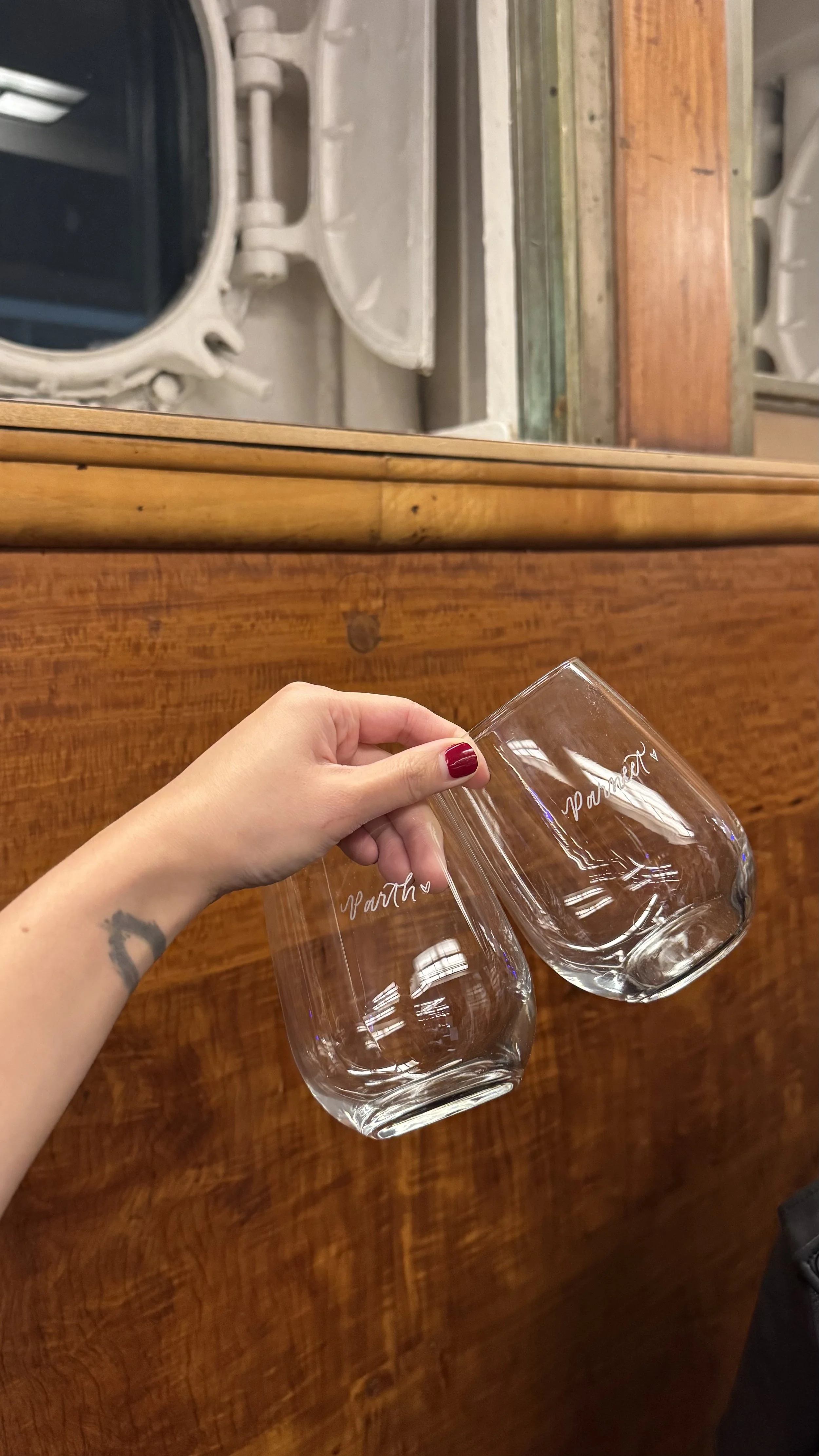 Hand engraved wine glasses for guests at a corporate holiday party on the Queen Mary in Long Beach, CA