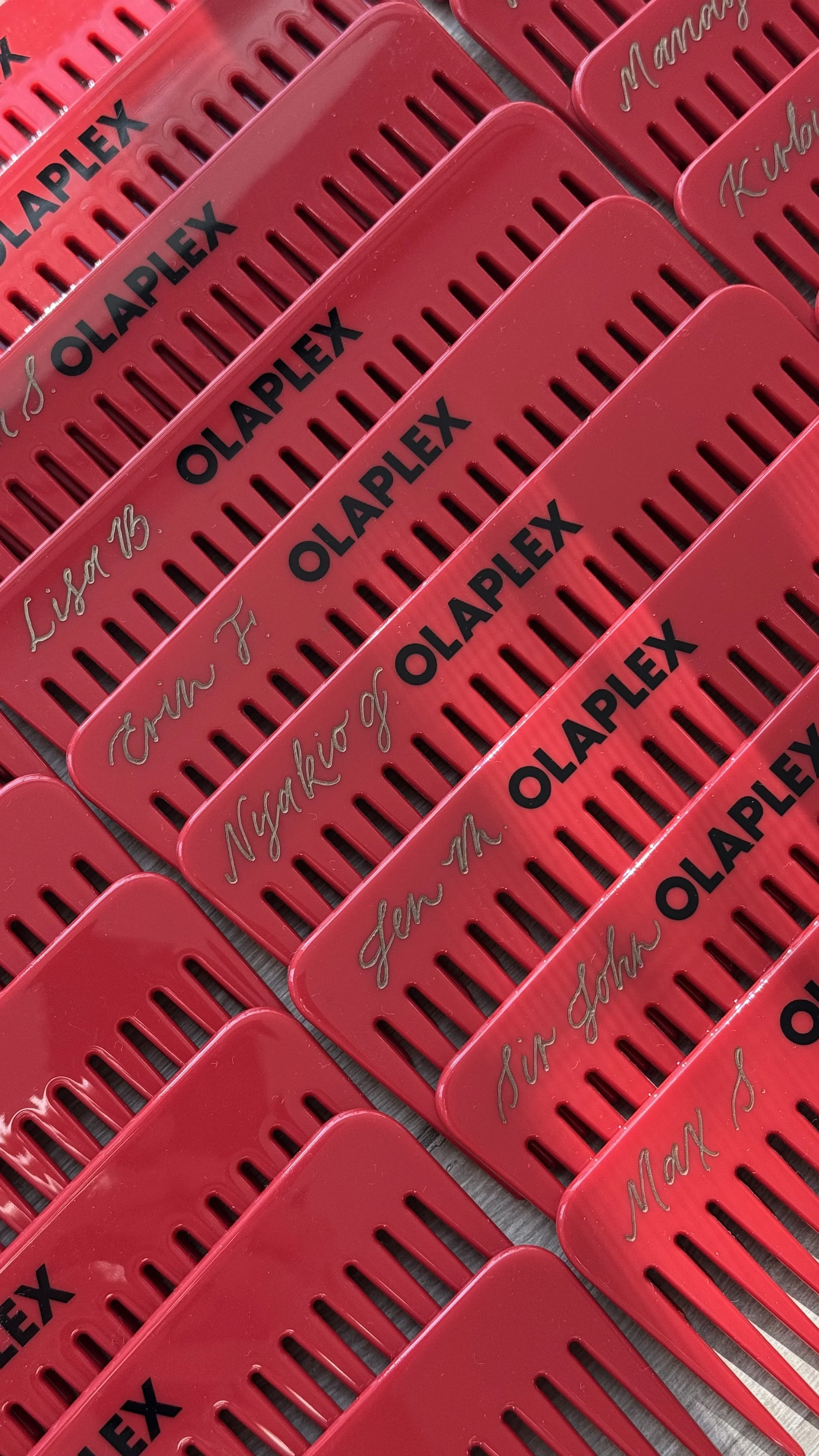 Hand engraved OLAPLEX combs to be used as place cards for a brand dinner in Los Angeles, CA