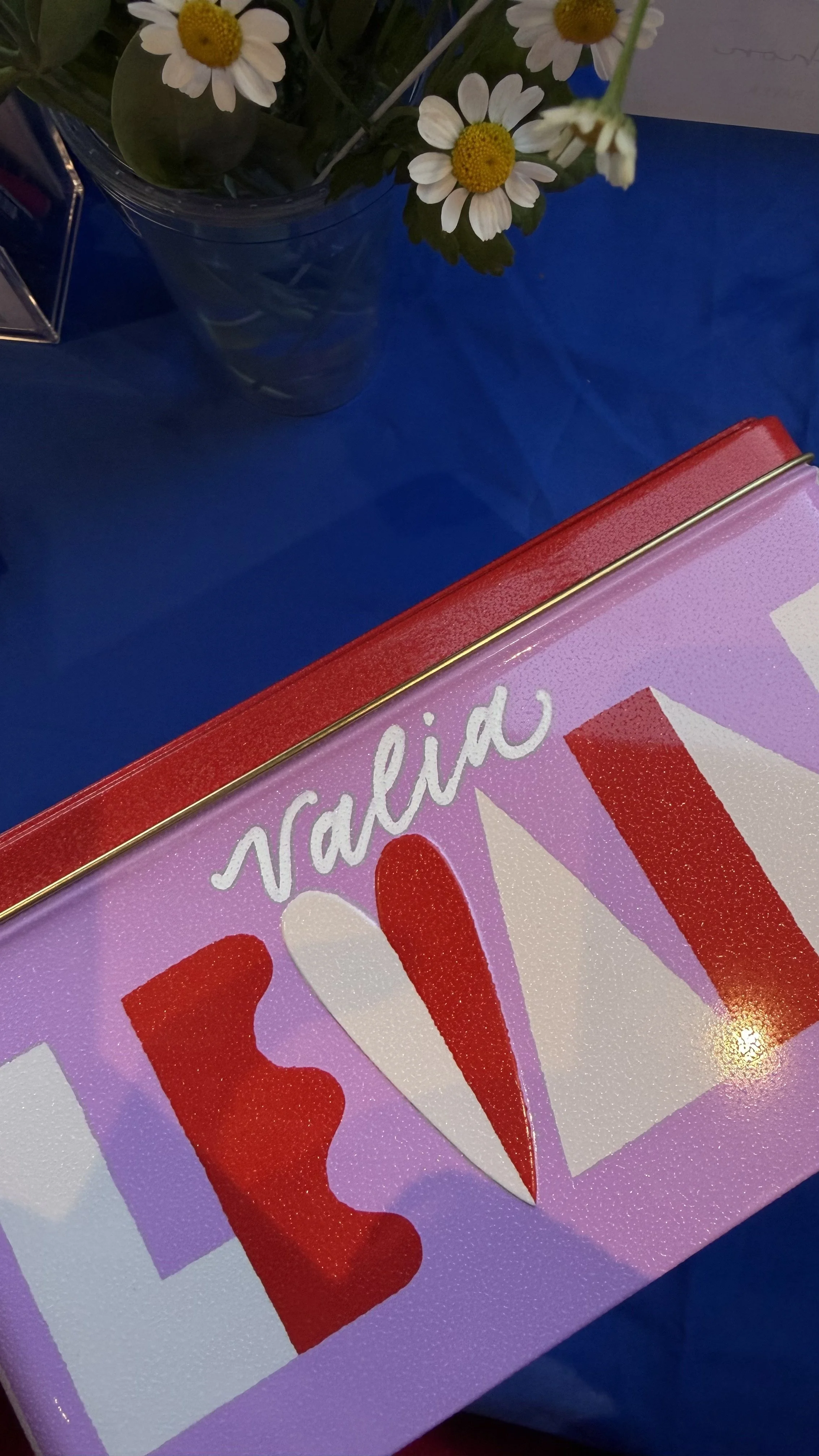 Custom calligraphy gift boxes at Levain Bakery retail activation
