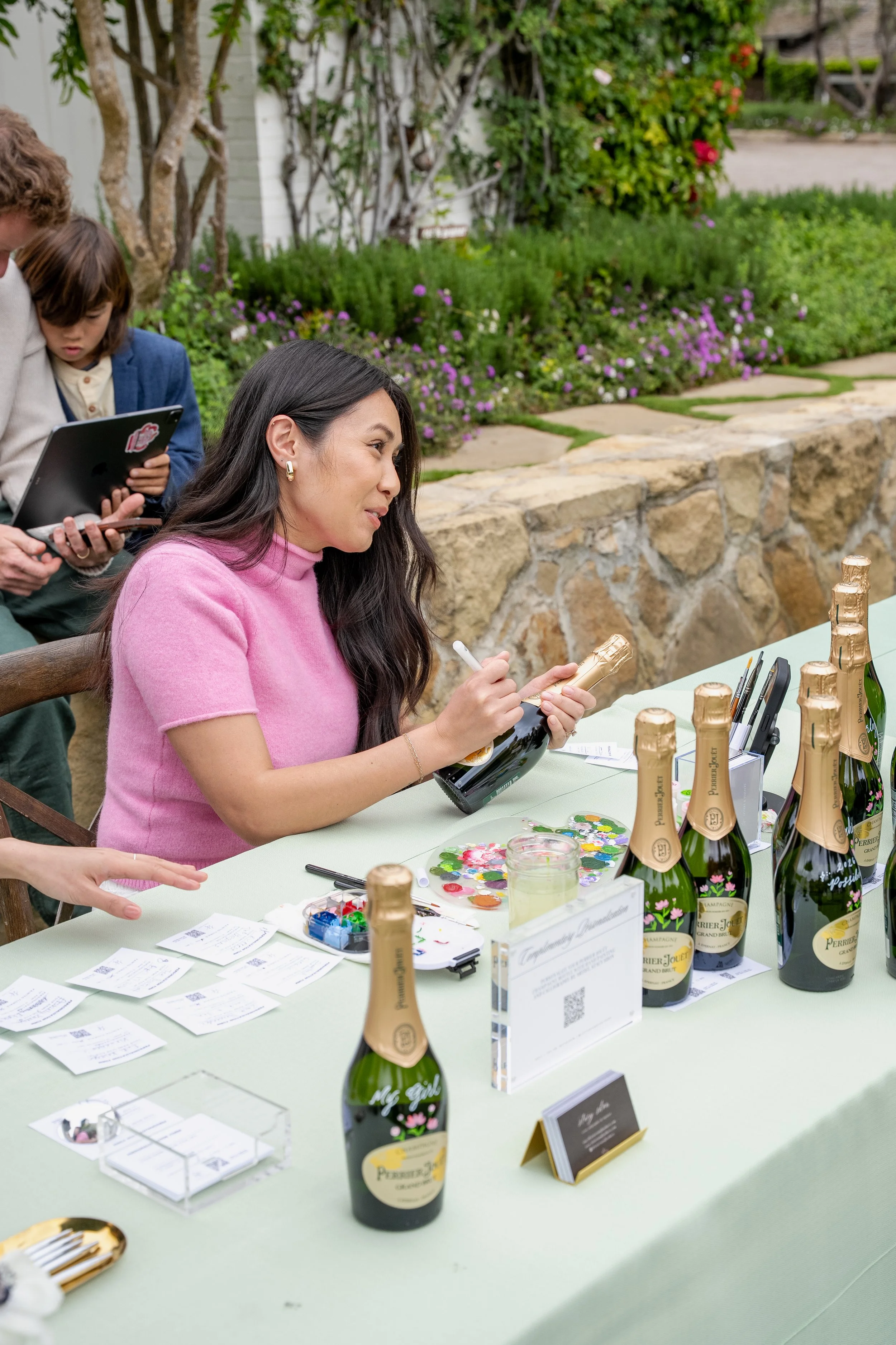 Stacy Shon interacting with guests at the Perrier-Jouet champagne brand activation event at San Ysidro Ranch