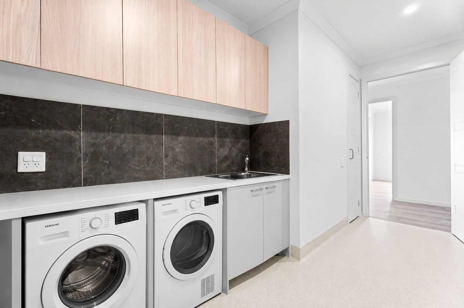 Modern Laundry with Integrated Washer and Dryer.png