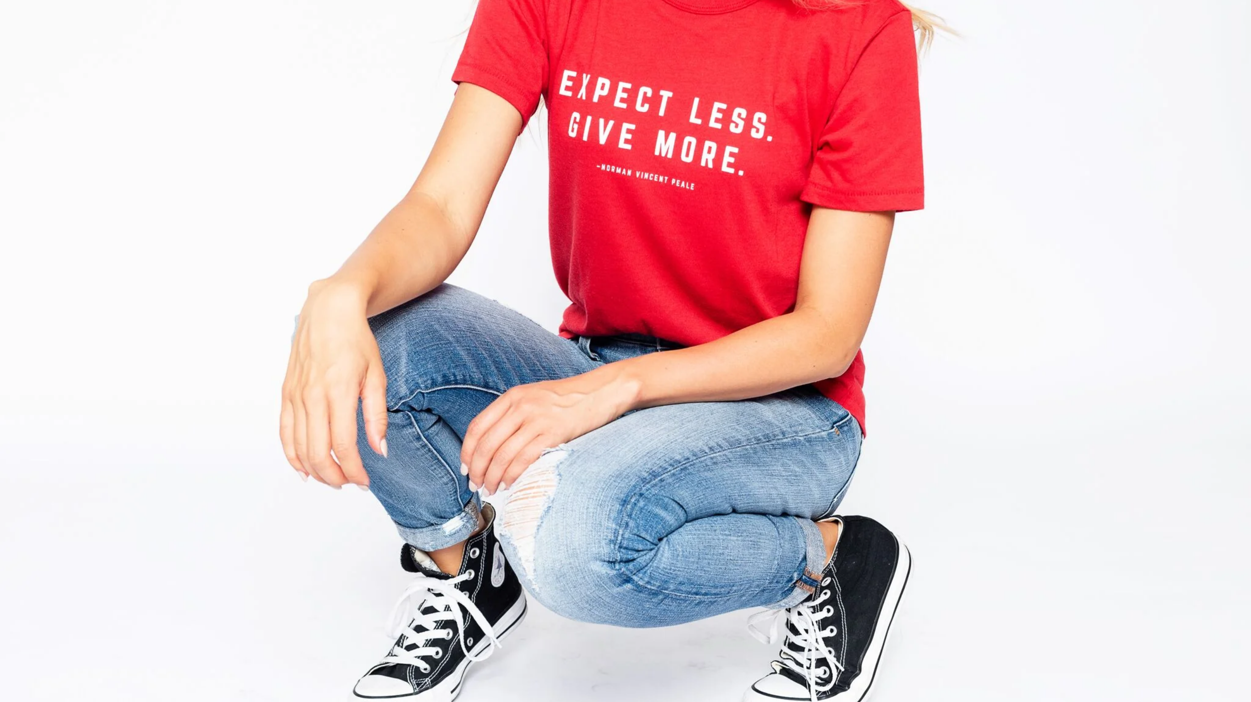 Lady striking a pose wearing a red Soul Honey shirt