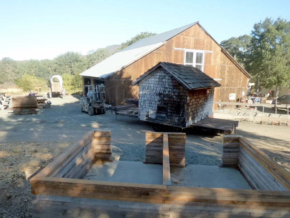 Due to termites and dry-rot, before placement, a new foundation and lower wall section had to be built.