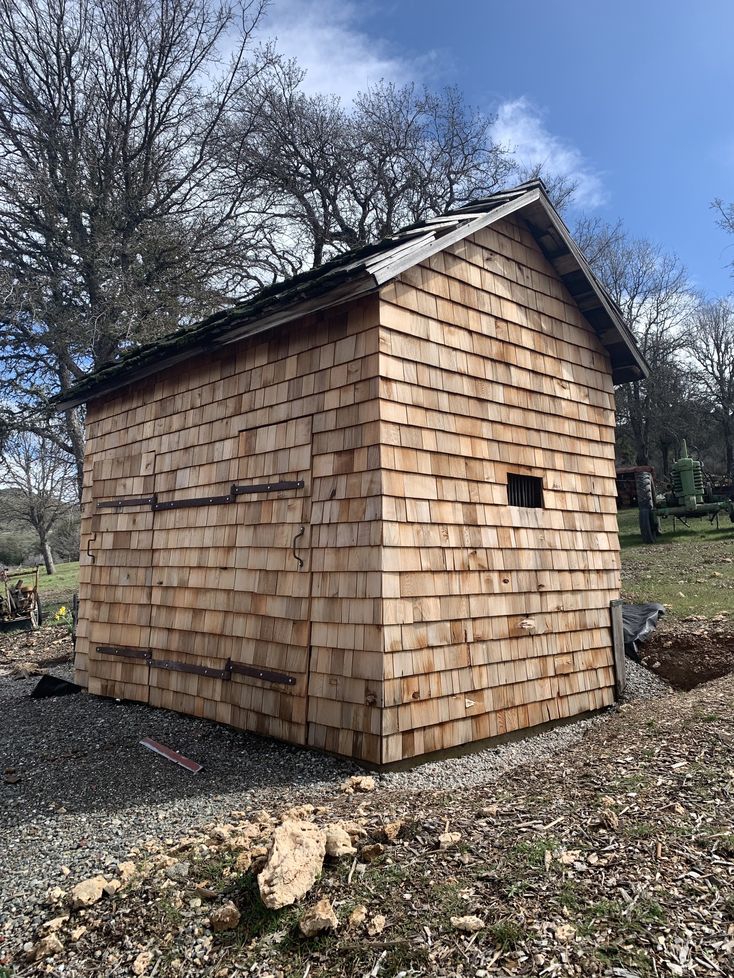 Restored and re-shingled jail front.