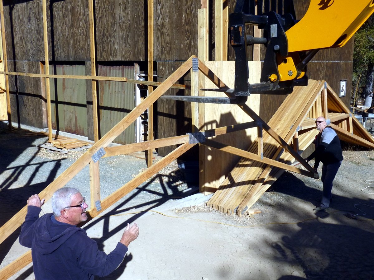 Building the barn to hold the blacksmith shop.