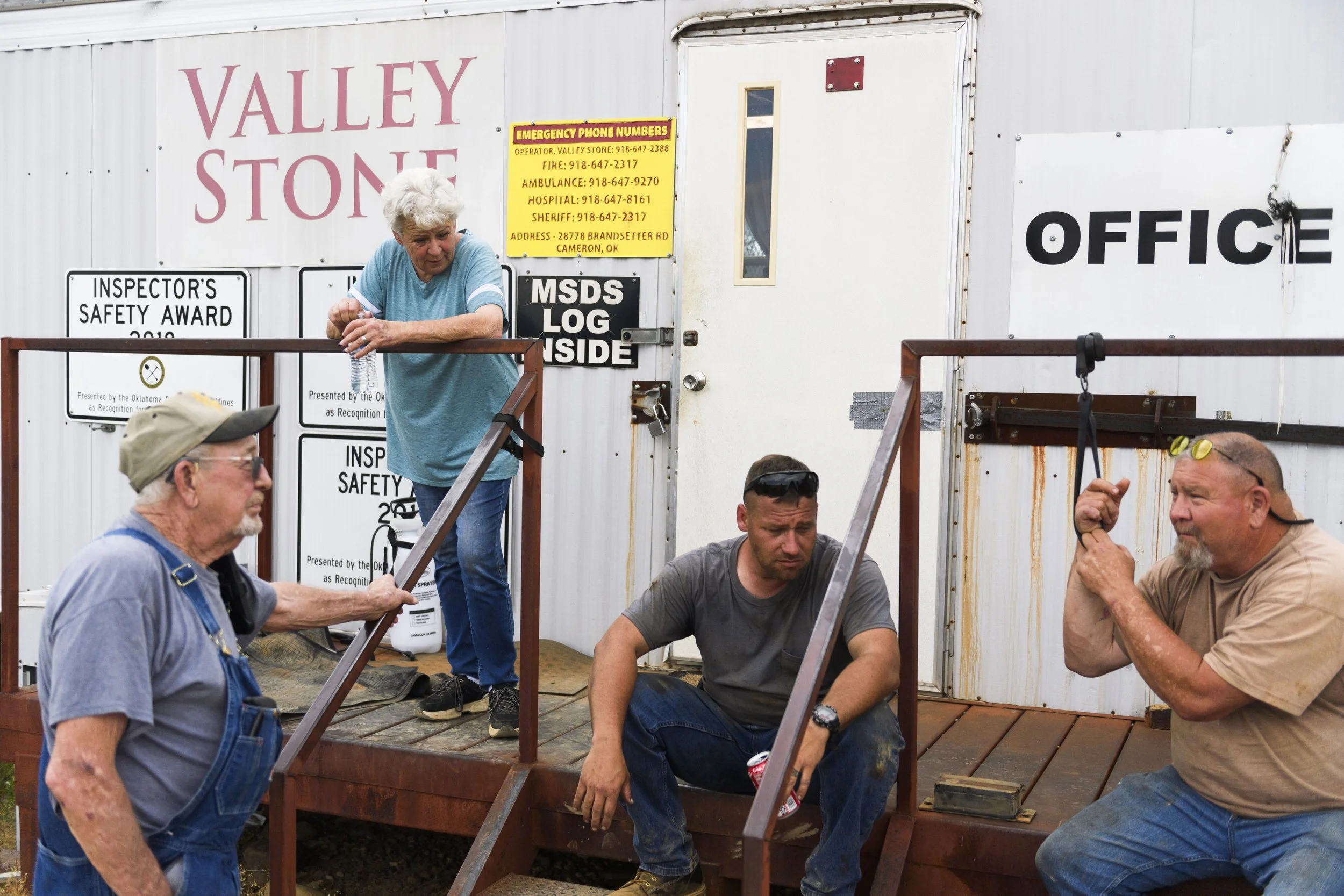 Johnny and Donna Webb, Trent Sewell, Jim Boatright catch up on at the end of their shift on May 13, 2023 at Valley Stone Quarry in Cameron, OK.