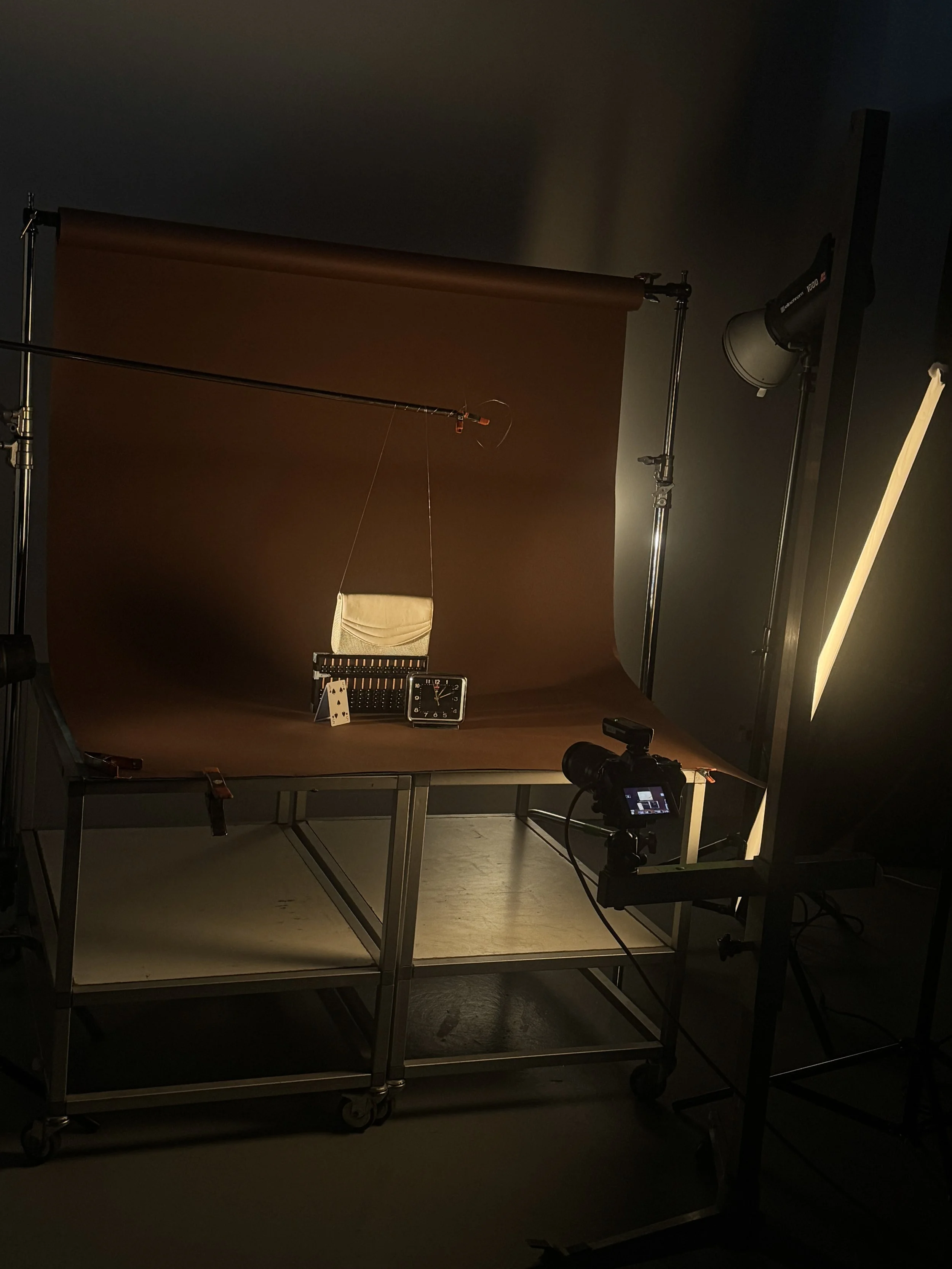 Behind the scenes photo of a product photography studio setup.