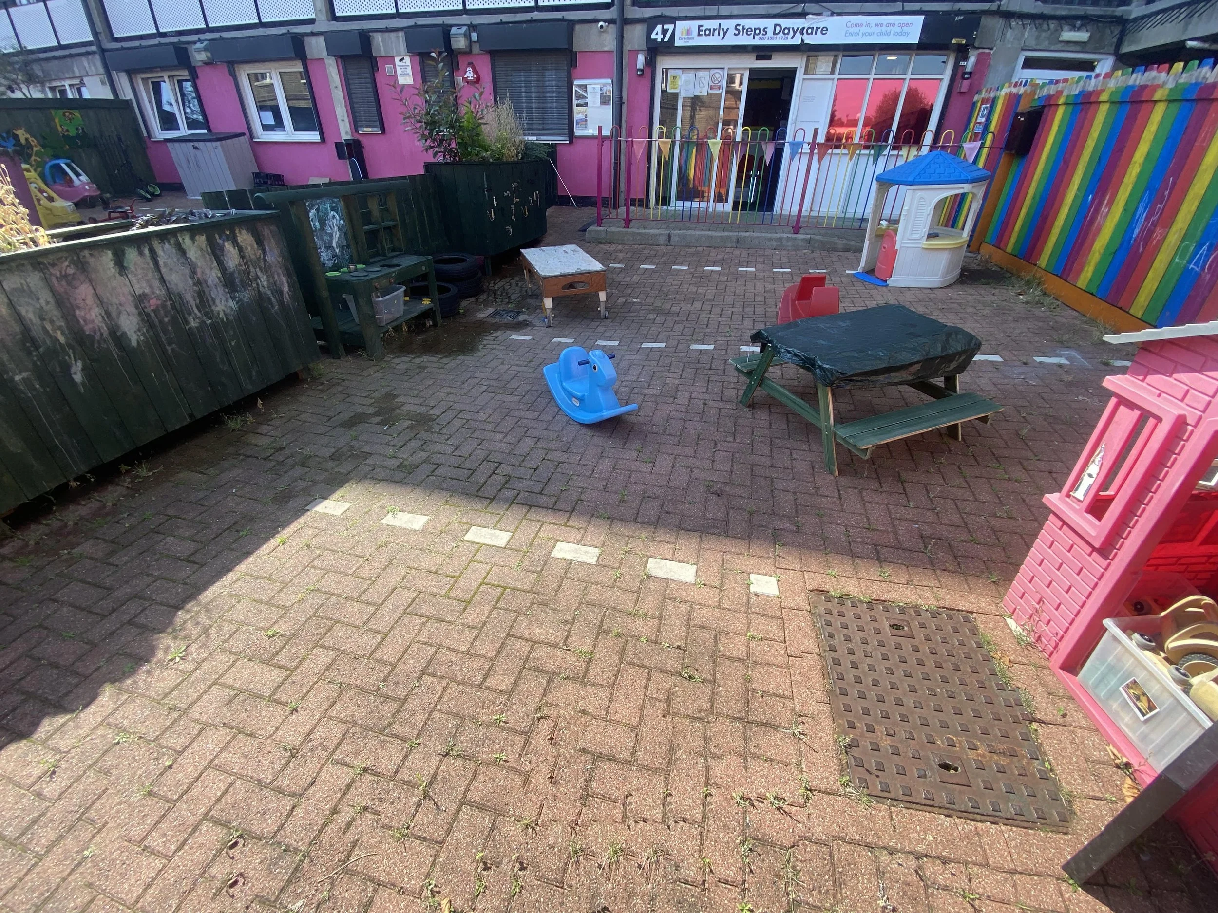 outdoor creative play area with water tray for sensory wet play