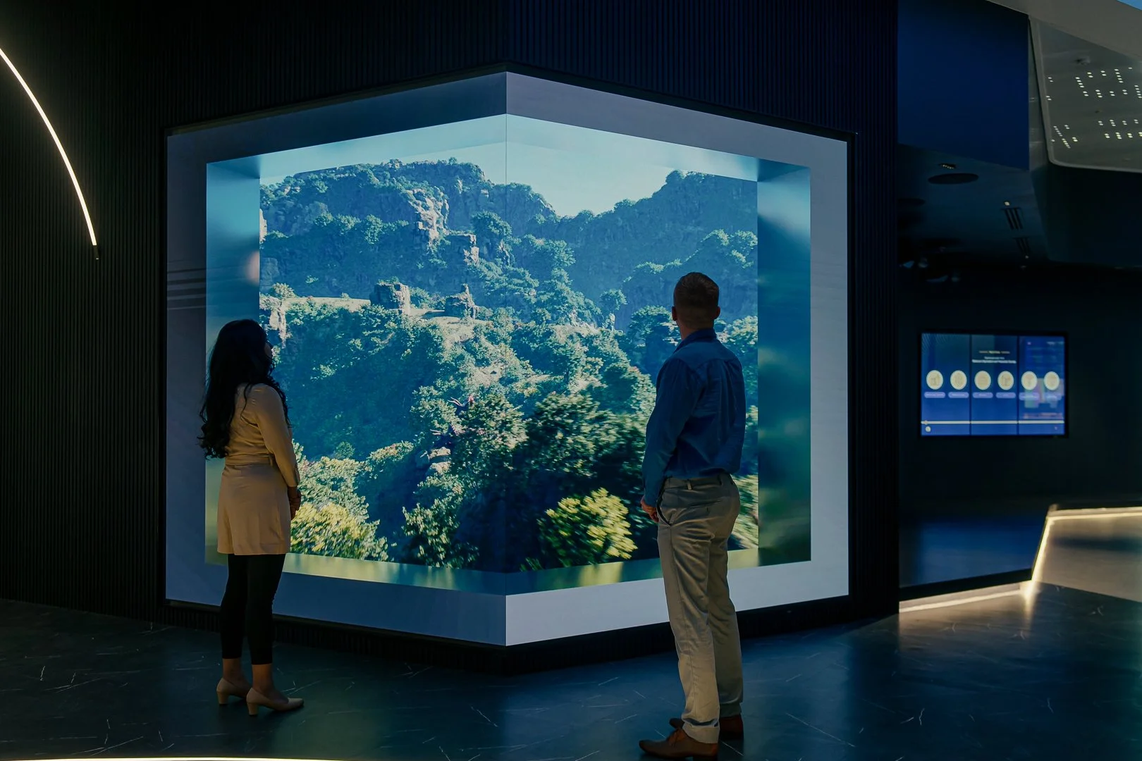 Anamorphic LED wall displaying immersive landscape content inside a corporate experience centre designed and delivered by DVSI.