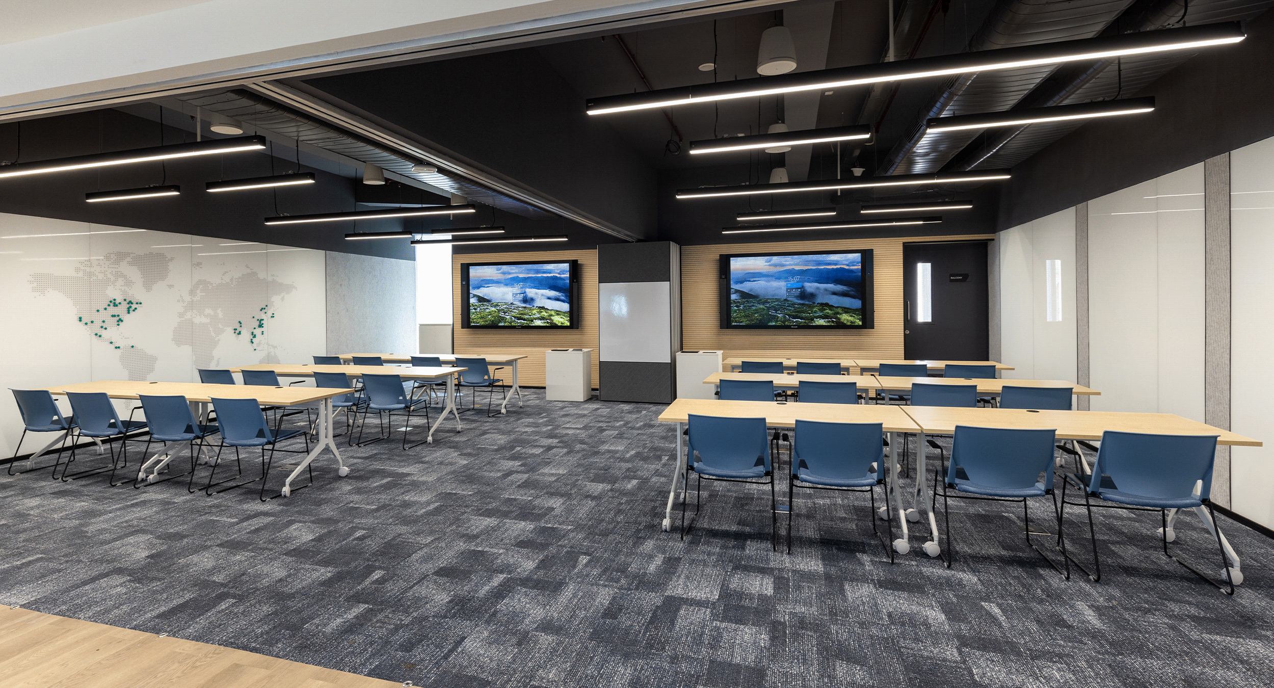 Audiovisual enabled training room with large format displays, flexible seating, and integrated presentation technology