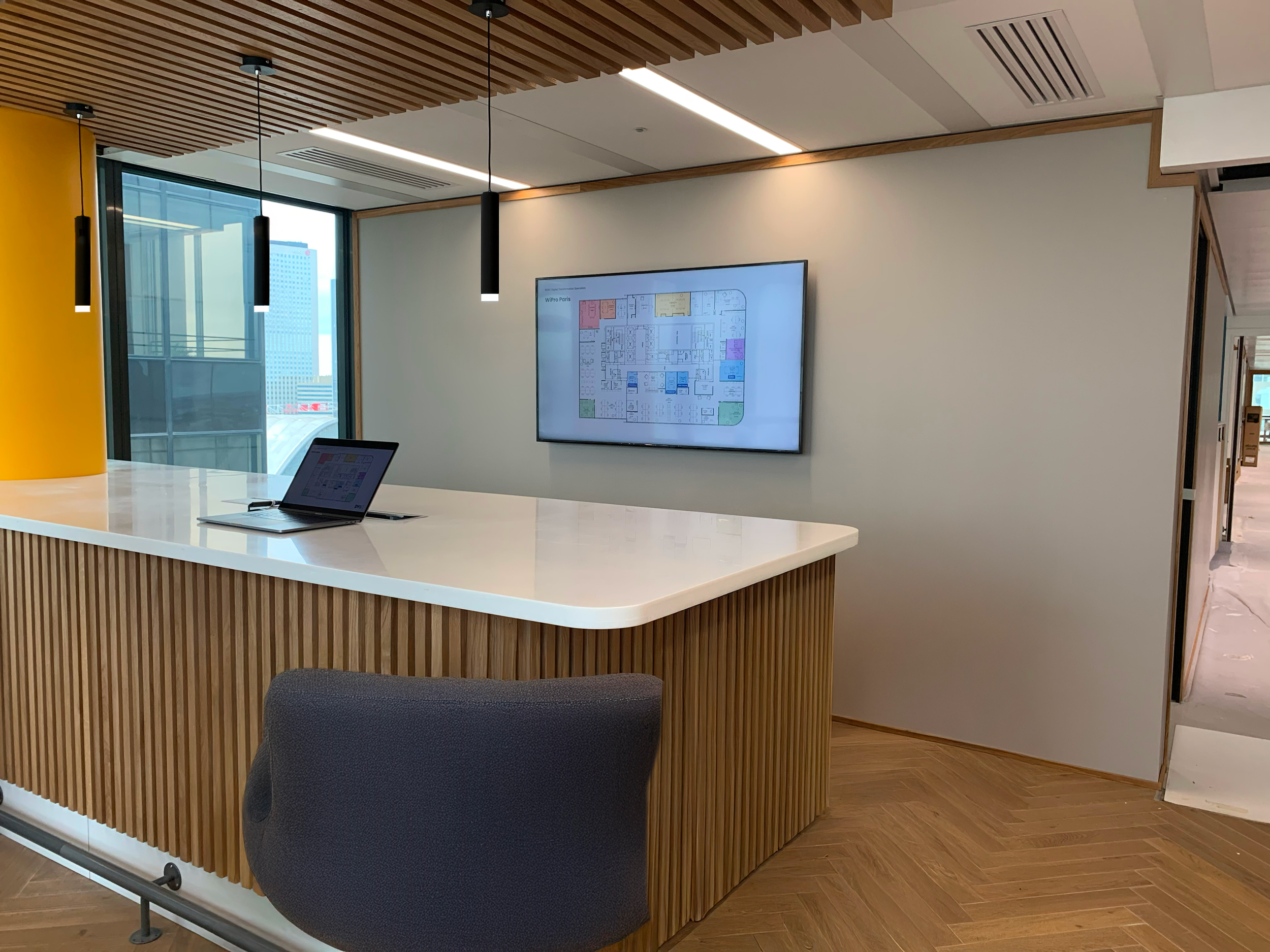 Collaborative workspace with digital floor plan display supporting space planning and team coordination