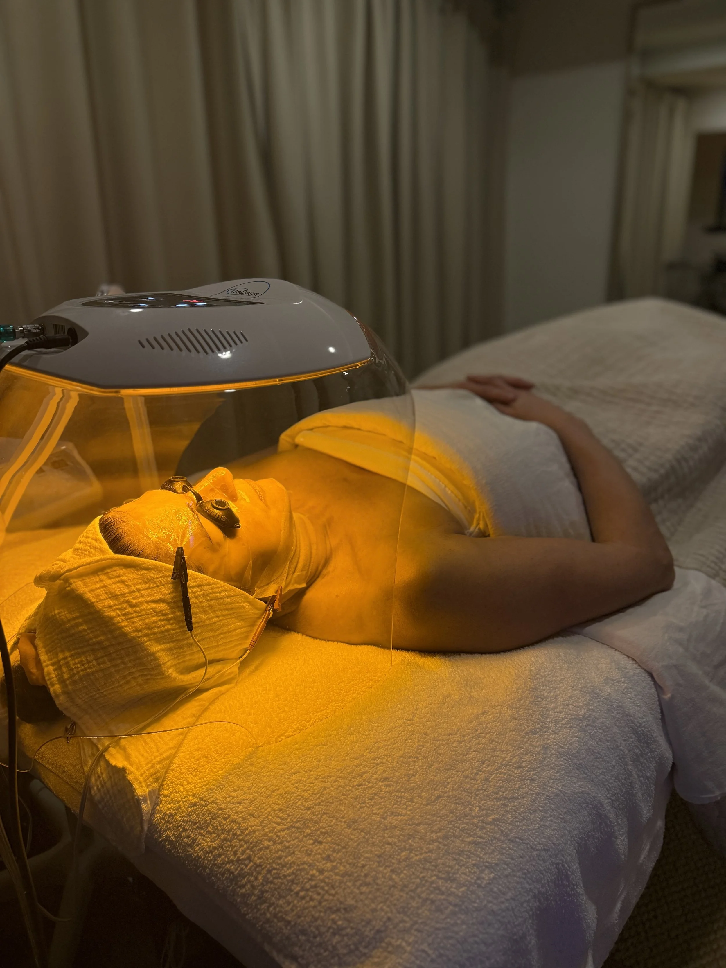 Advanced LED light therapy and oxygen dome treatment during Signature Bespoke Facial at JE'DERM skin atelier Upper West Side NYC