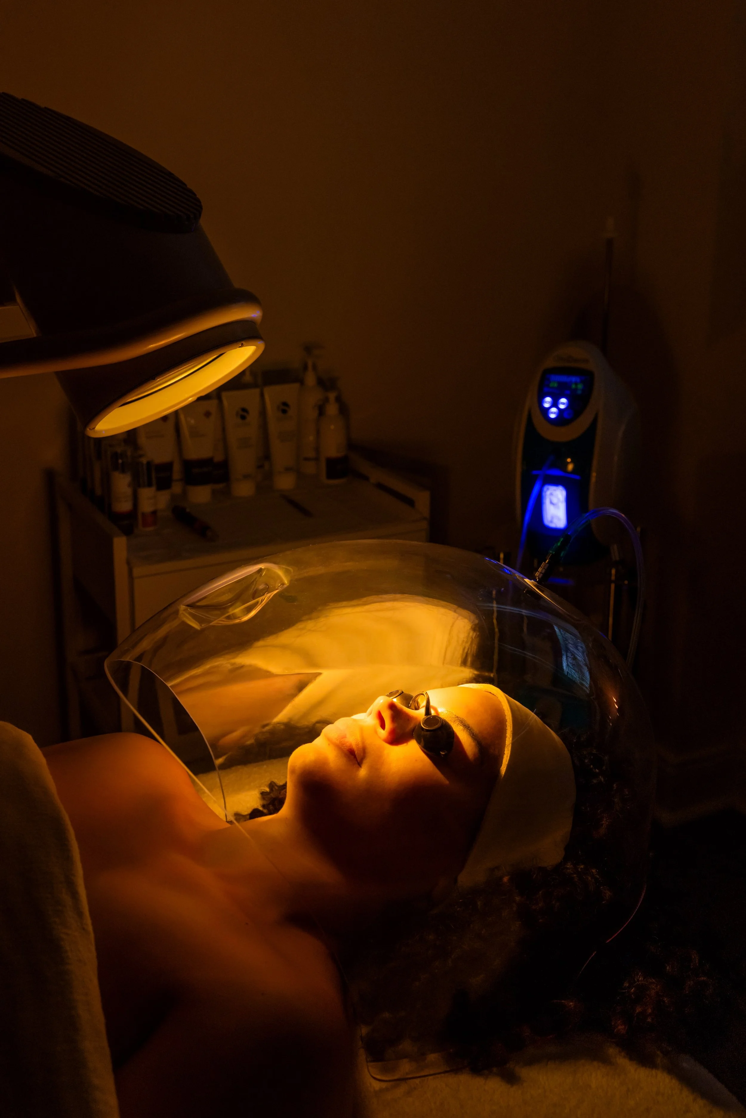 woman getting LED light therapy for face