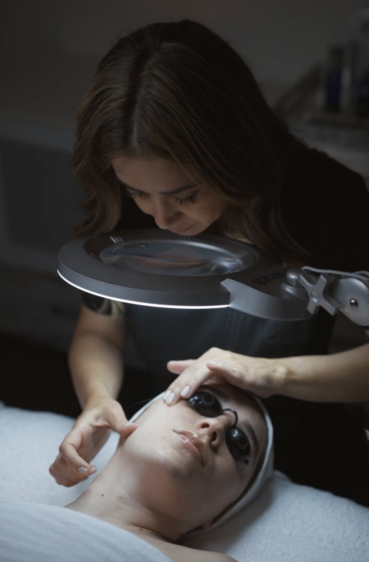 Professional skin analysis and consultation during bespoke facial treatment at JE'DERM skin atelier New York