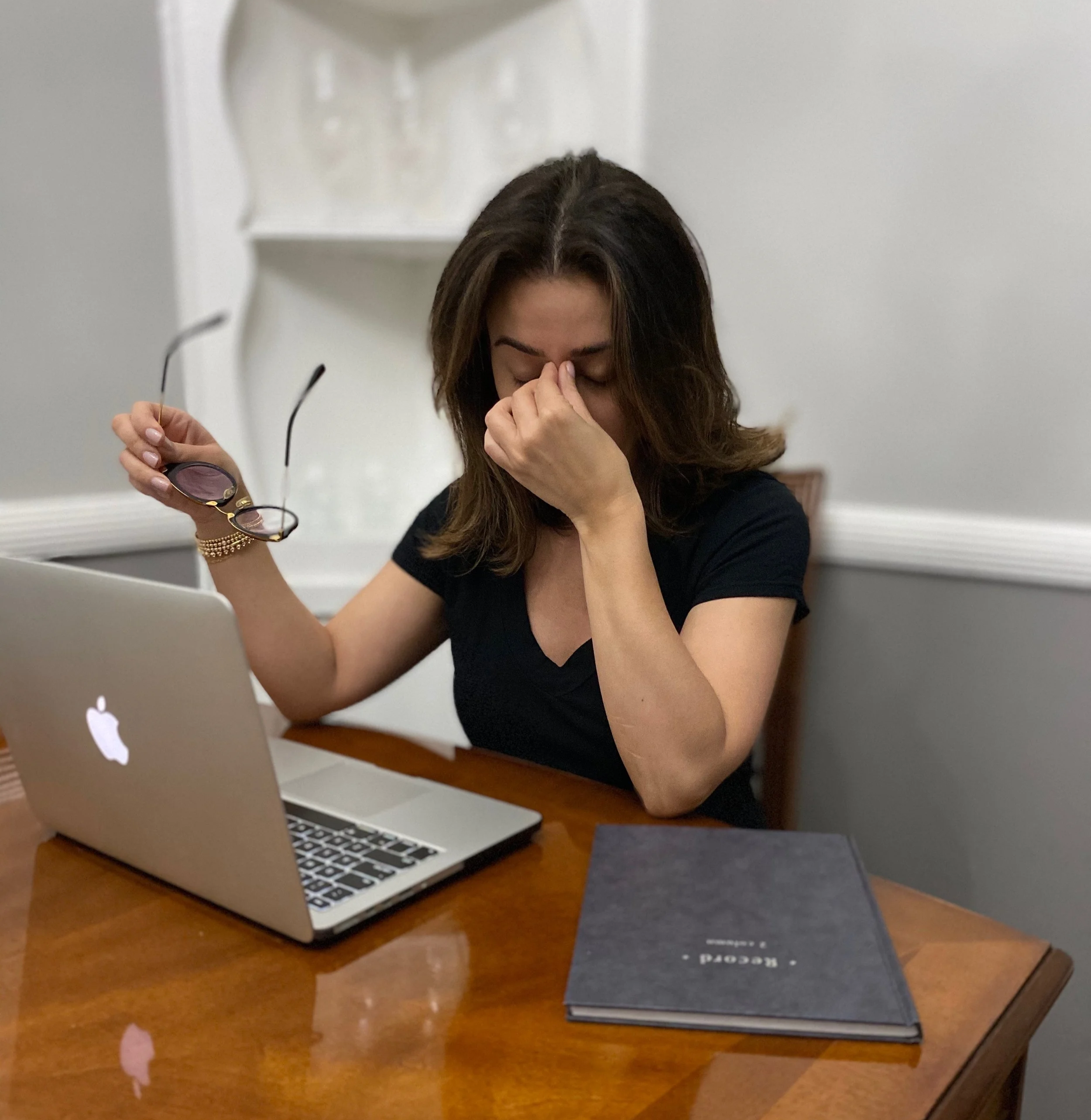 Woman with stressed expression, skin showing signs of stress-related breakouts and dullness