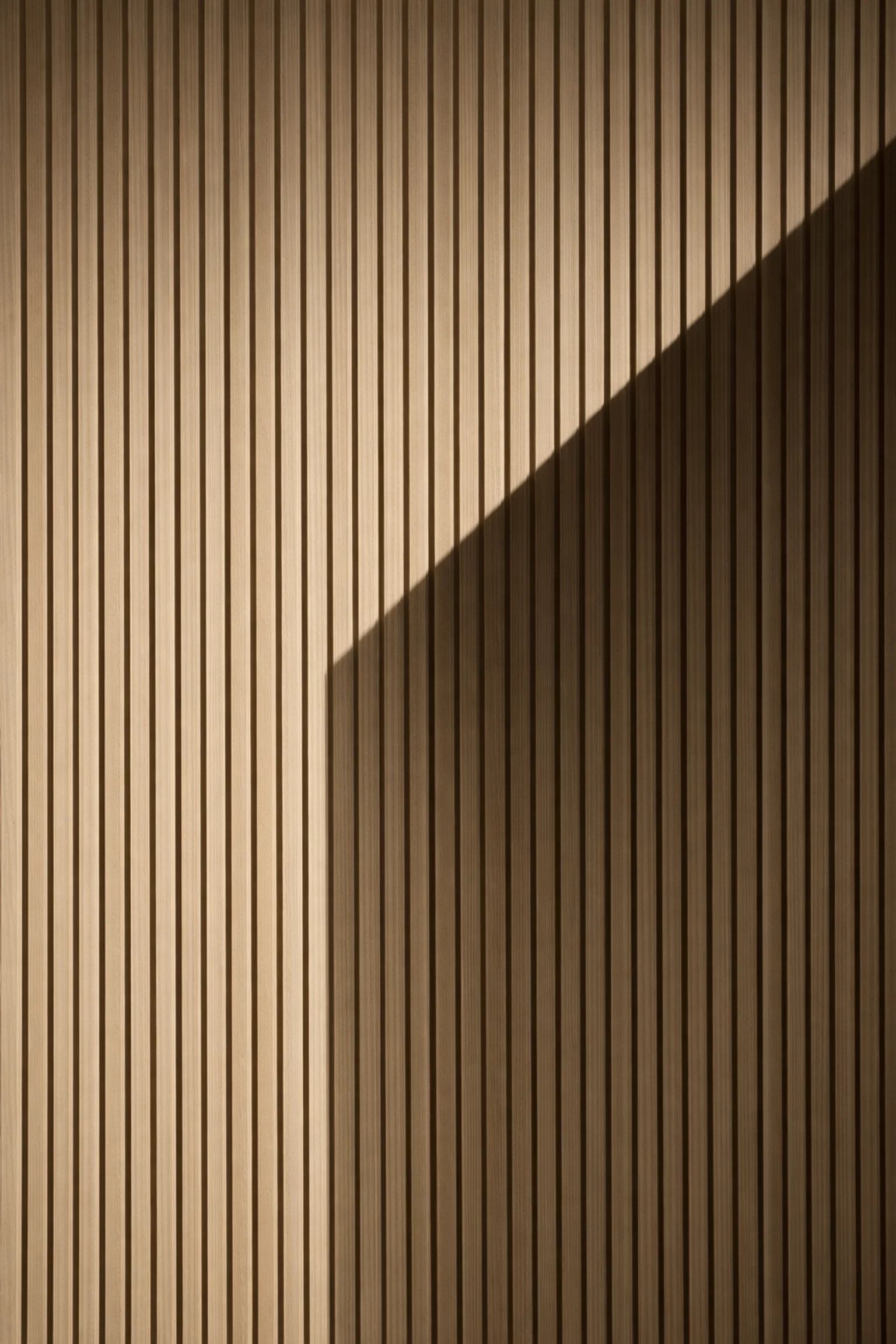 Tactile bouclé chair and travertine table in South Florida light showing editorial architectural detail.