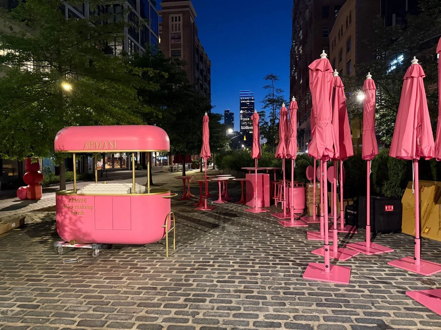 The completed blush kiosk at blue hour