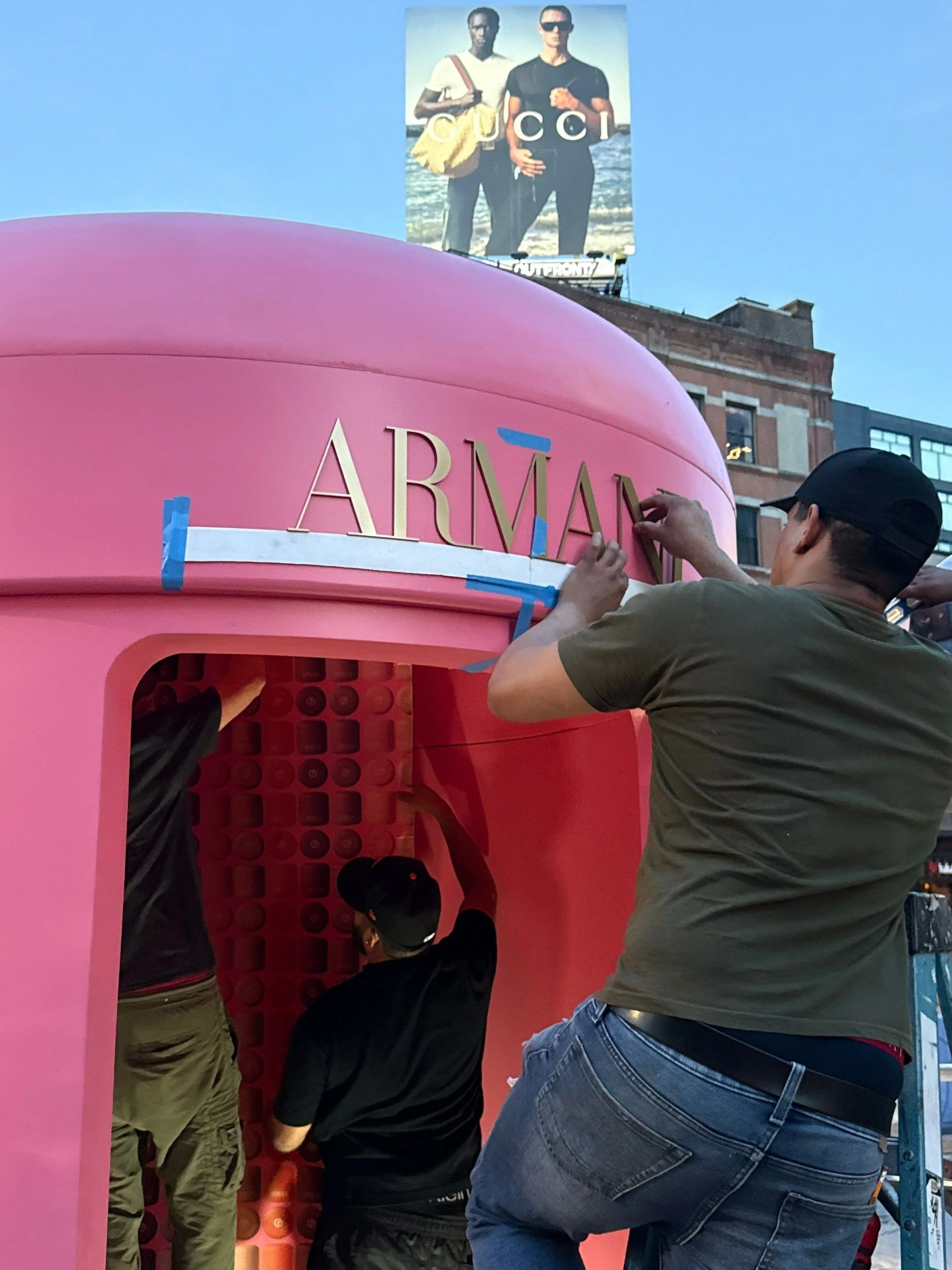 Installing the ARMANI letters.