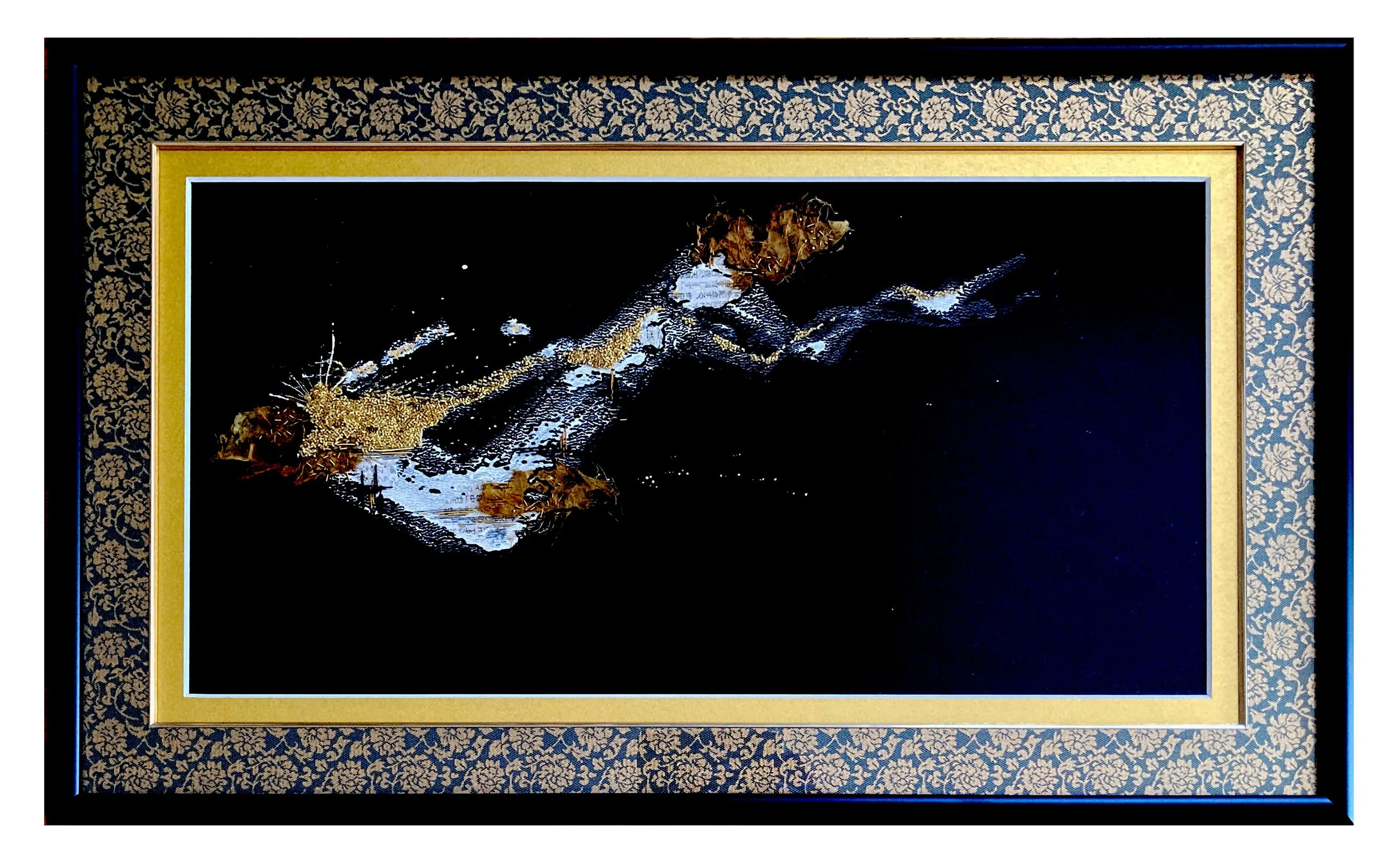 abstract art piece with dark background and gold accents in ornate frame