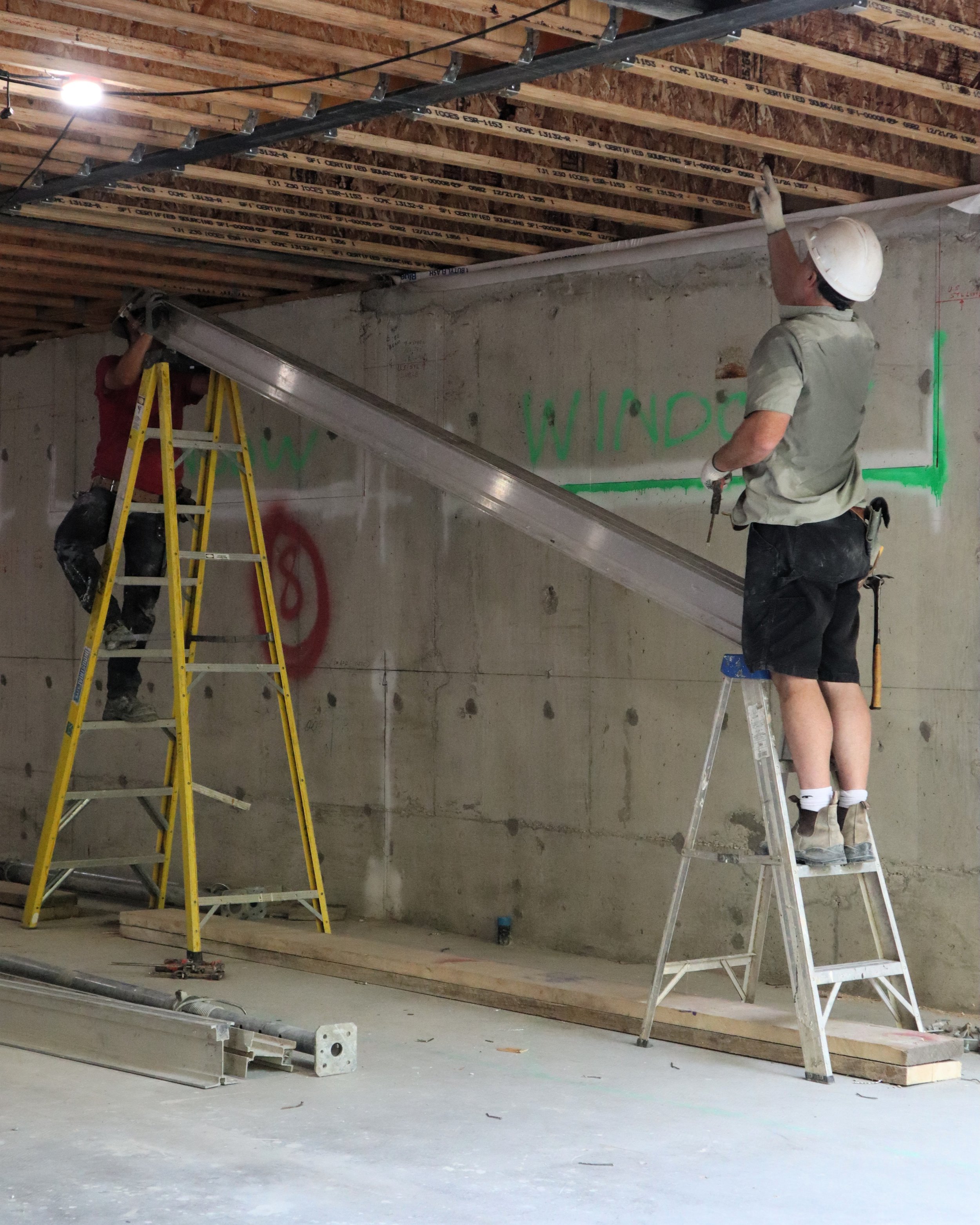 Johnson Playfair masons preparing temporary shoring supports on a renovation in Toronto.