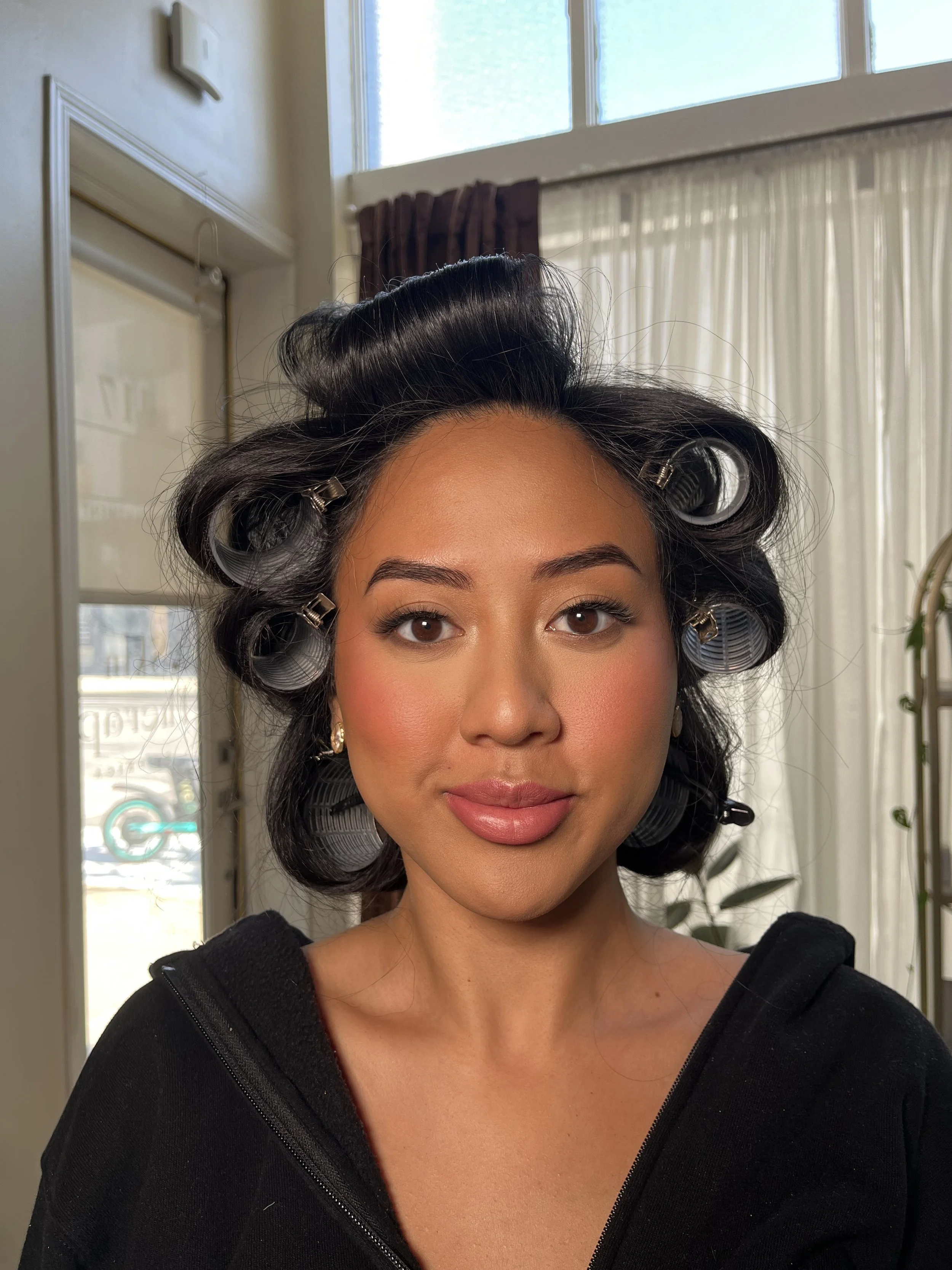 Asian woman with a full glam makeup look with sultry eyes and bright pink cheeks, blended beautifully. Makeup done by Erica K. 