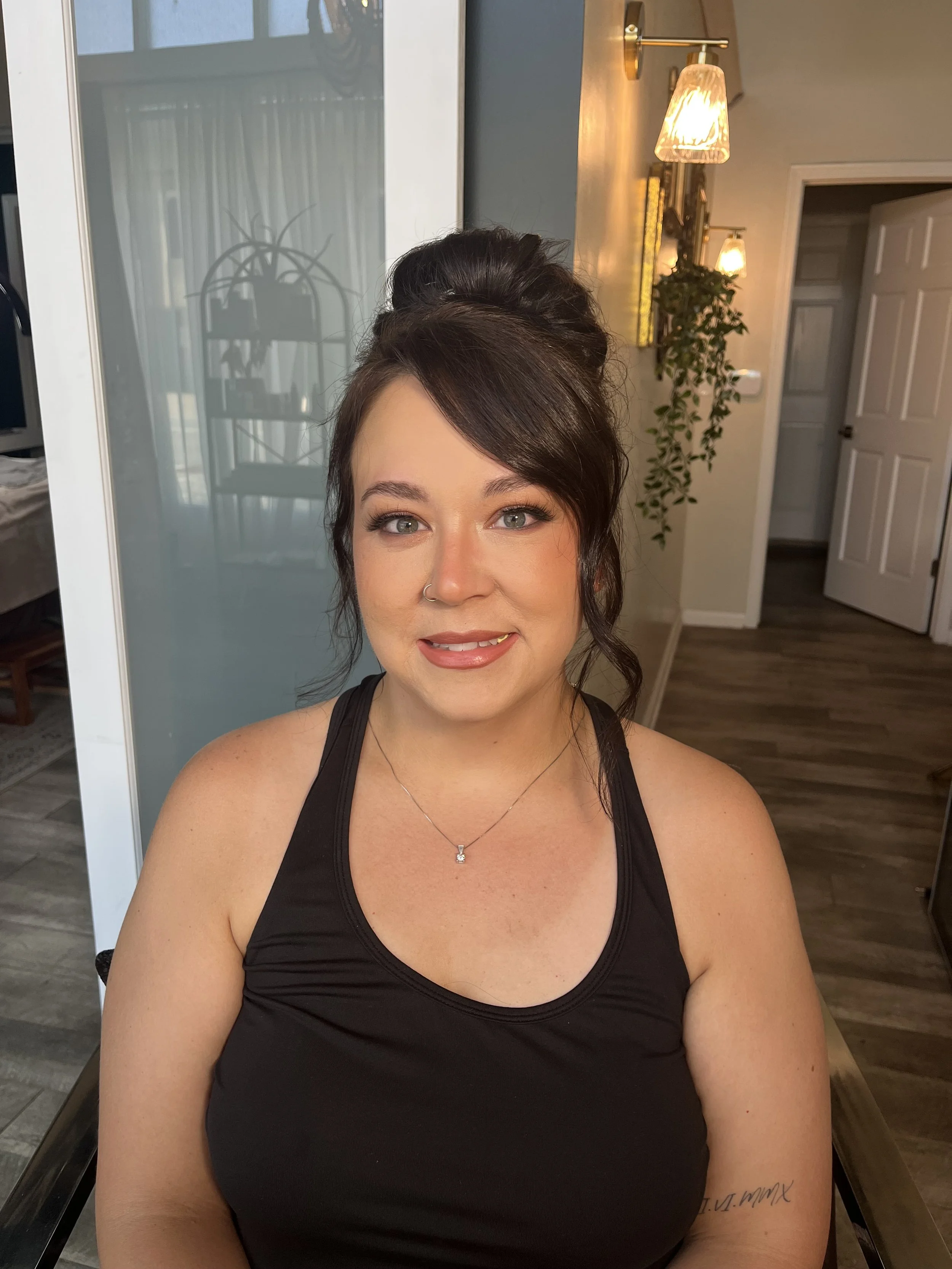 Caucasian woman who got a warm bronze makeup look with shimmers. Makeup done by Erica K.