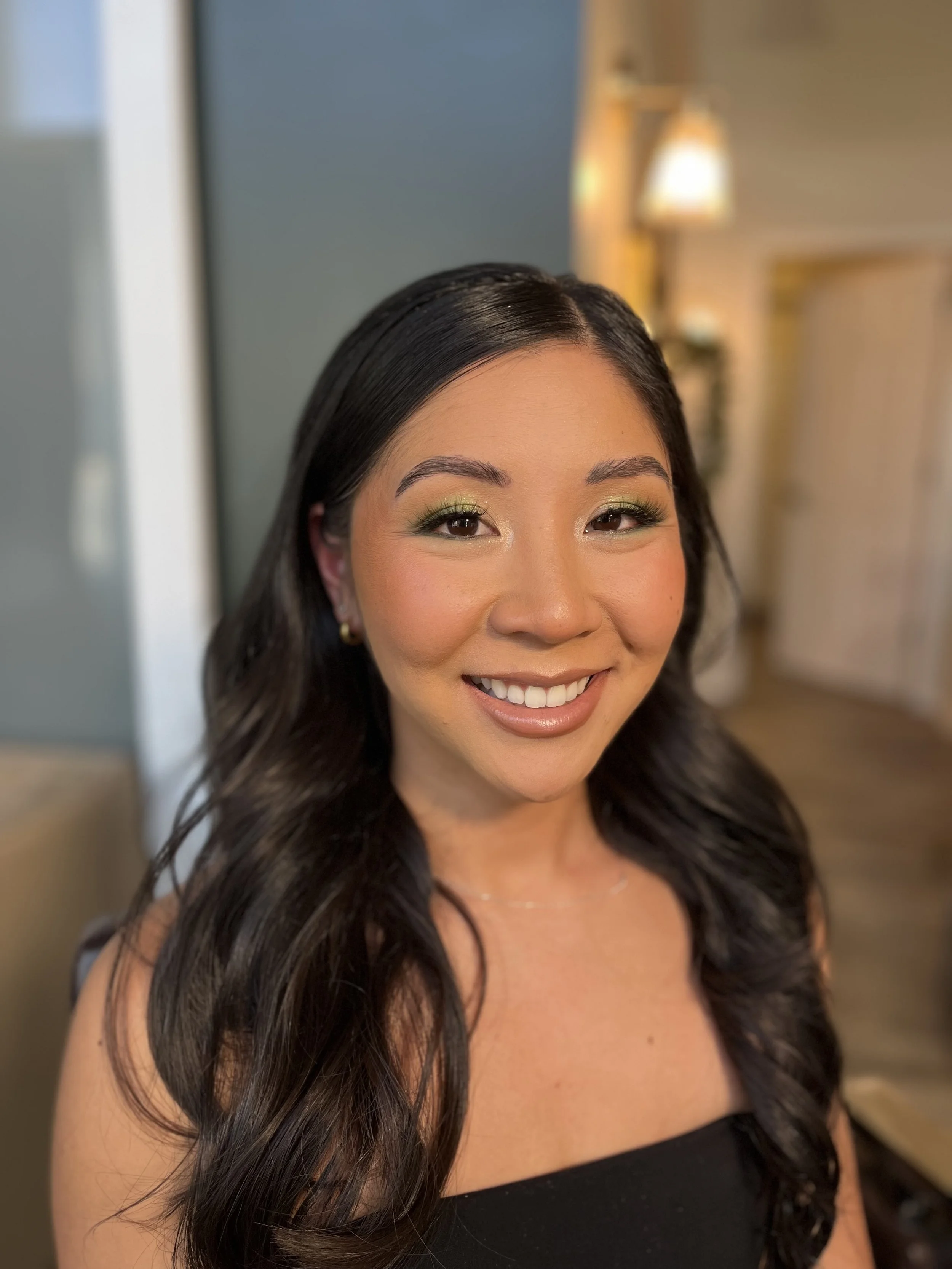 Asian Woman with a full glam fun makeup look, with lime green eye shadow blended beautifully with shimmers and transition colors. Makeup done by Erica K.