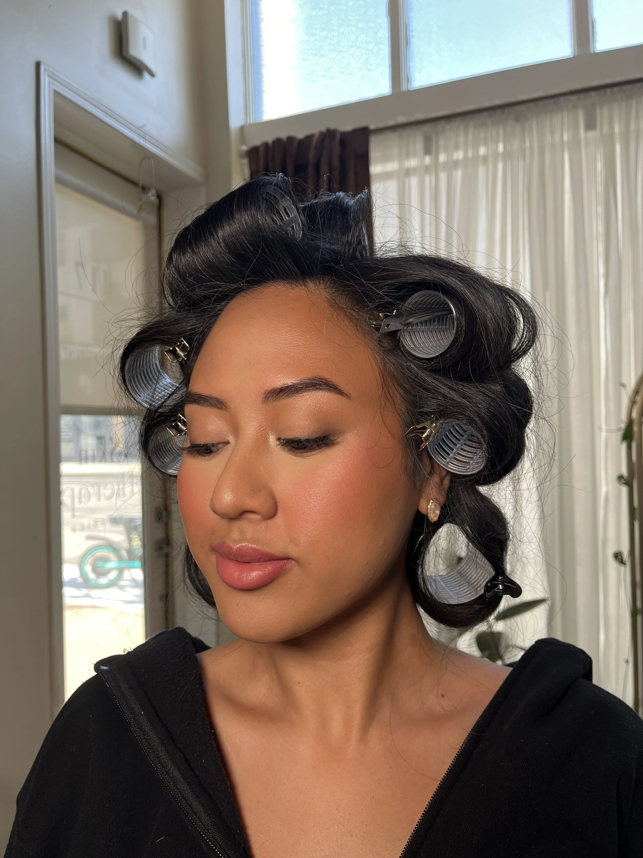 Asian woman with a full glam makeup look with sultry eyes and bright pink cheeks, blended beautifully. Makeup done by Erica K. 