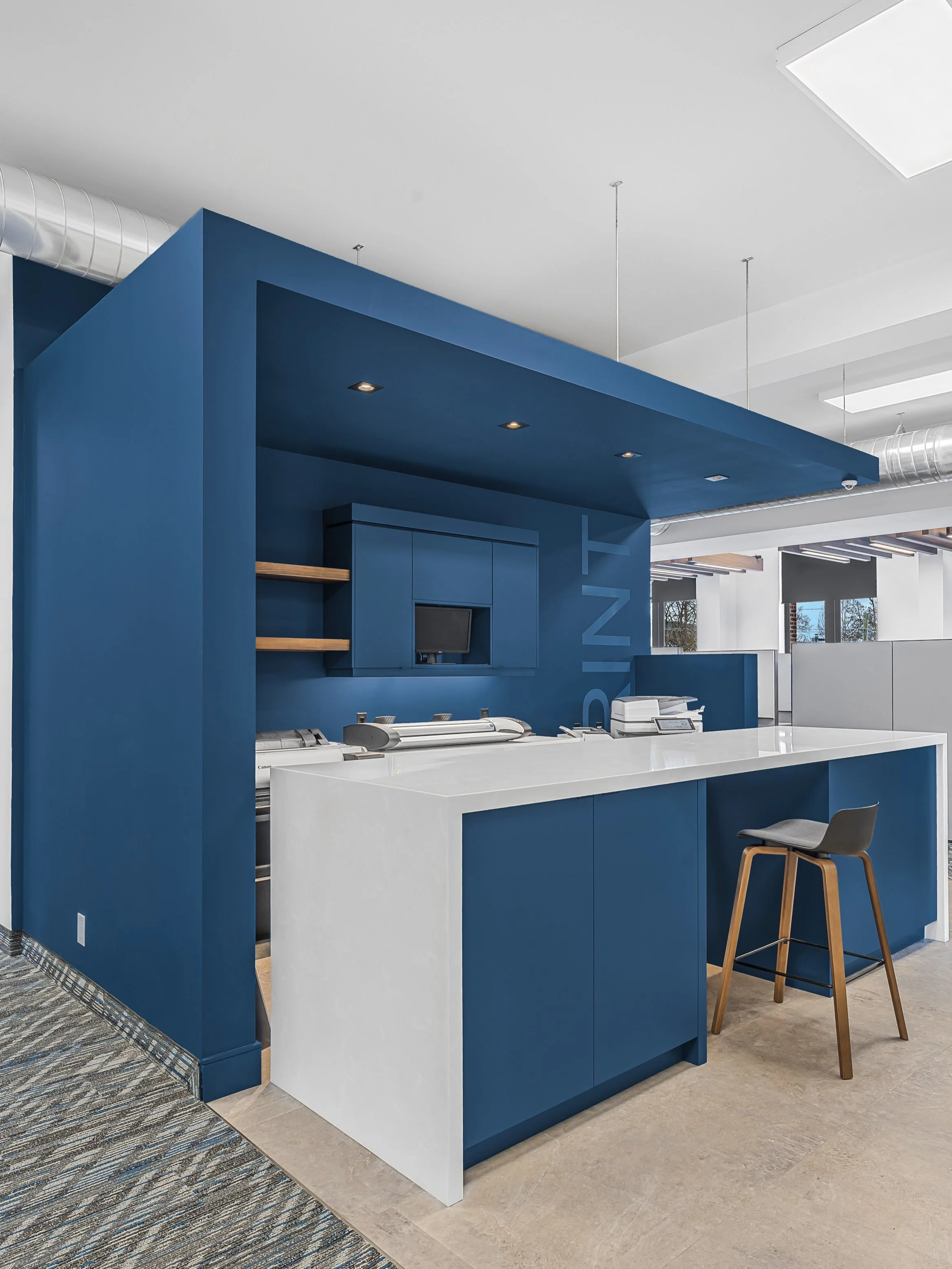 Meet the Print Hub, Thorold Development Service Office&rsquo;s new central hotspot for collaborative drawing reviews. By incorporating a dropped ceiling, we created an inviting micro environment that offers employees a perfect visual break from their