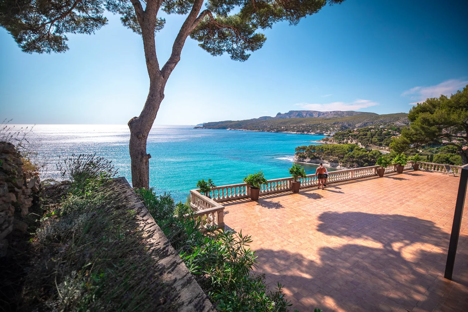 Villa terrace overlooking the water in Europe, set for a wedding