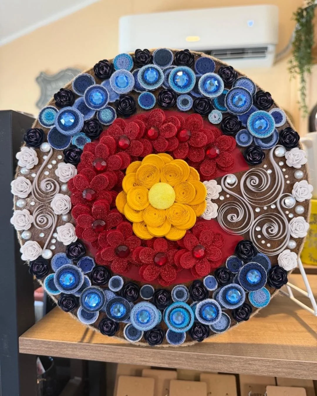 A little piece of Colorado, made by hand.

This paper quilled design is a detailed take on the Colorado symbol, built layer by layer with incredible precision and care. Every coil, shape, and color is placed by hand, making it truly one of a kind.

I