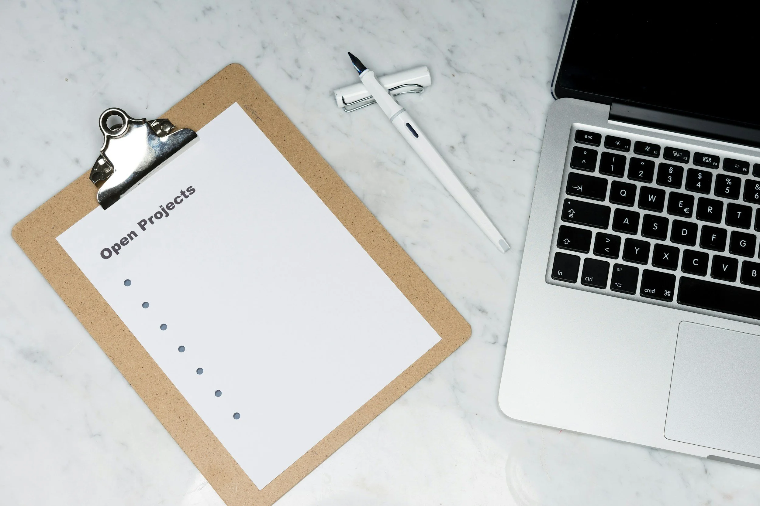 Compliance checklist on a clipboard representing SMB1001 and Essential Eight certification readiness services from SSDL