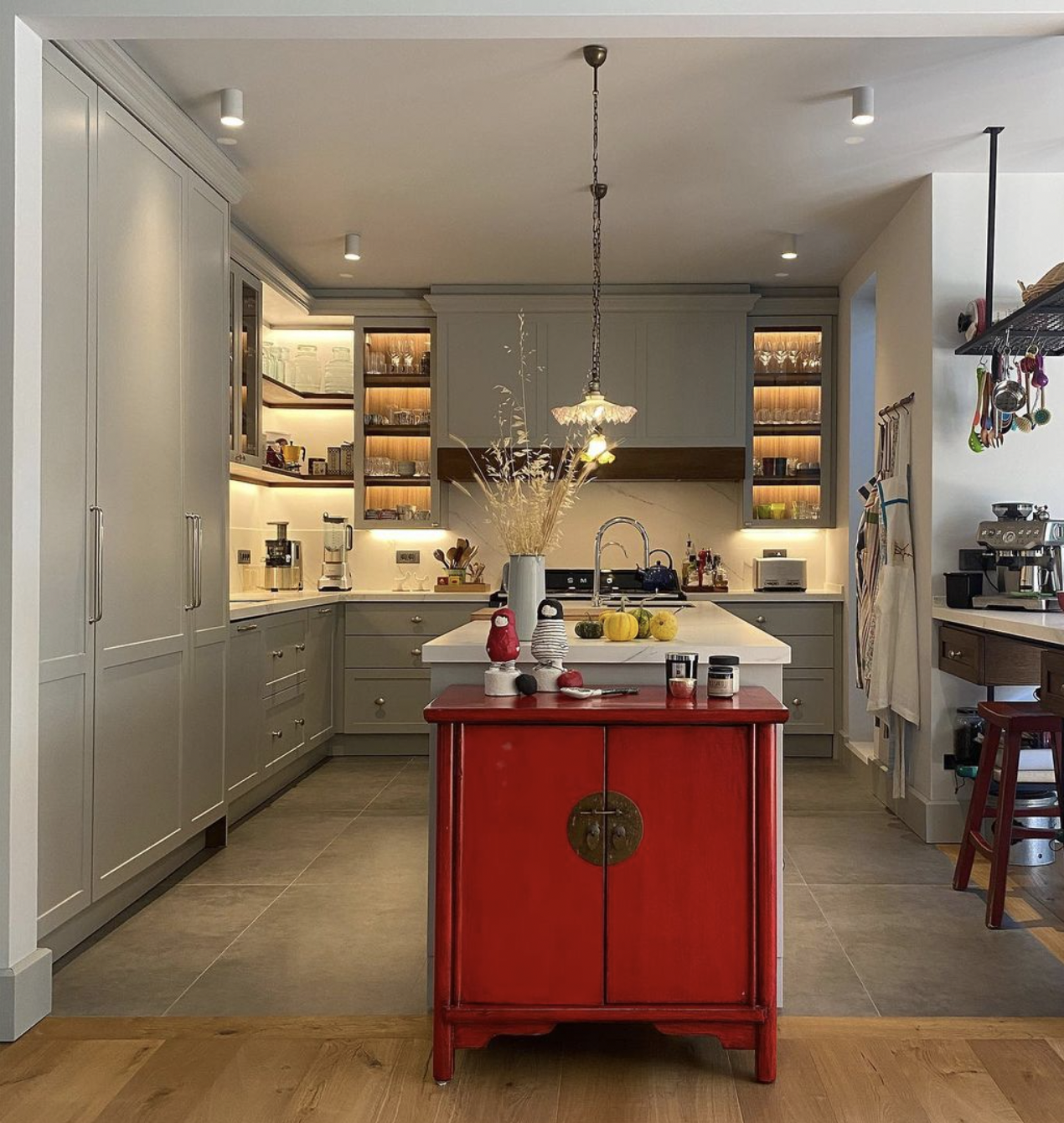 Light Blue-gray and walnut kitchen with white marble countertops