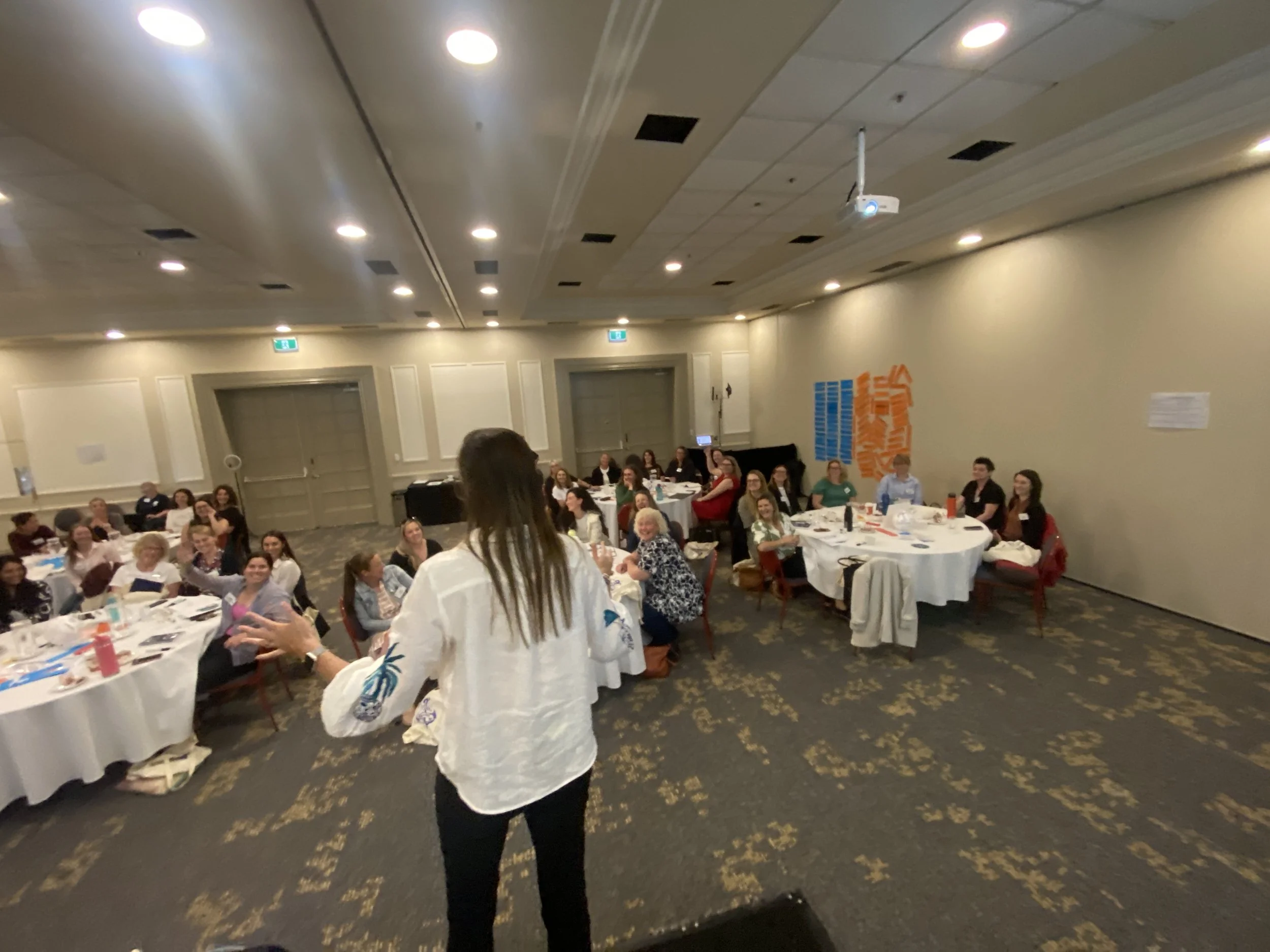 Participants engaging in reflection and resilience exercises led by Lucy Byrne