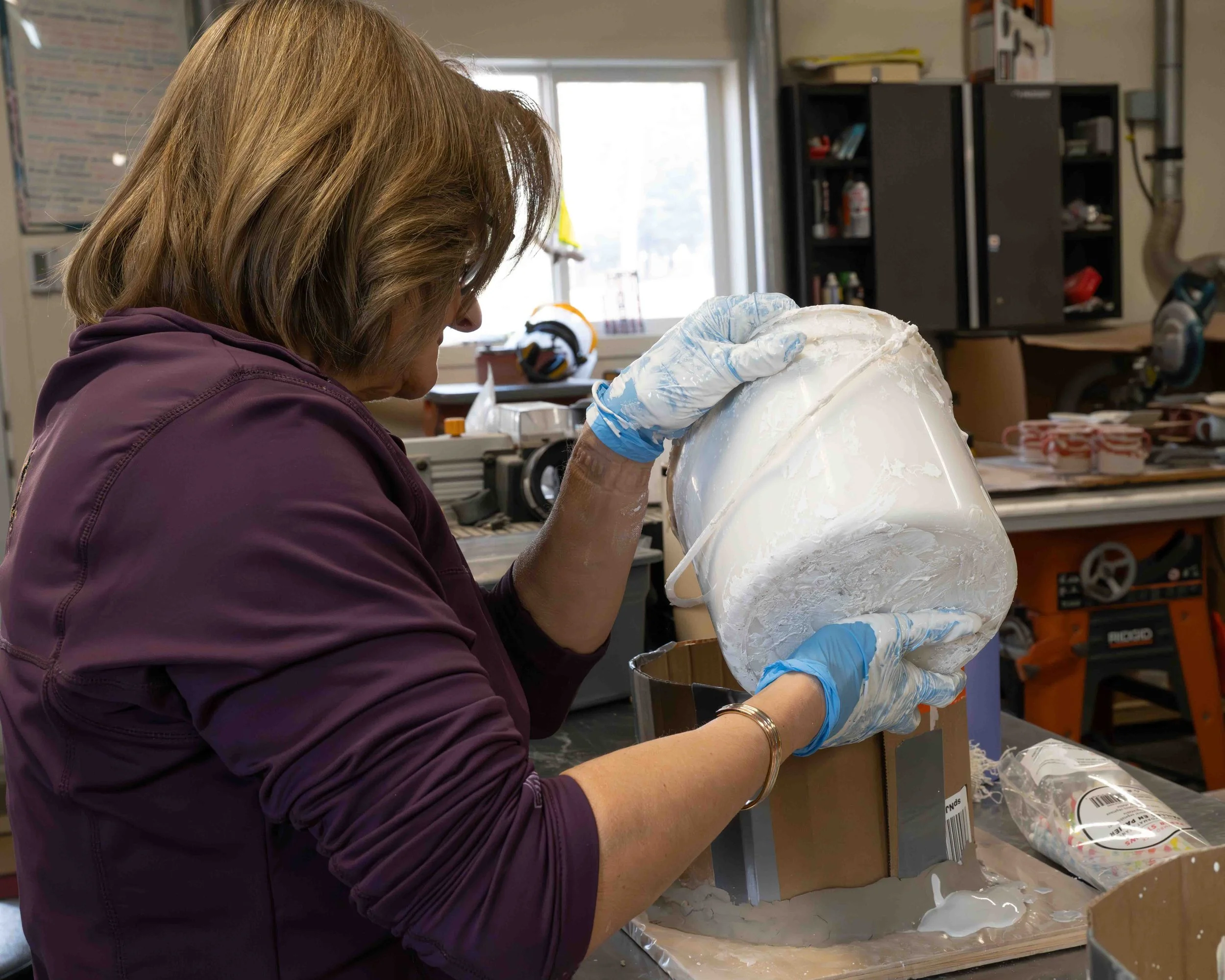 Pouring the plaster into the moulds