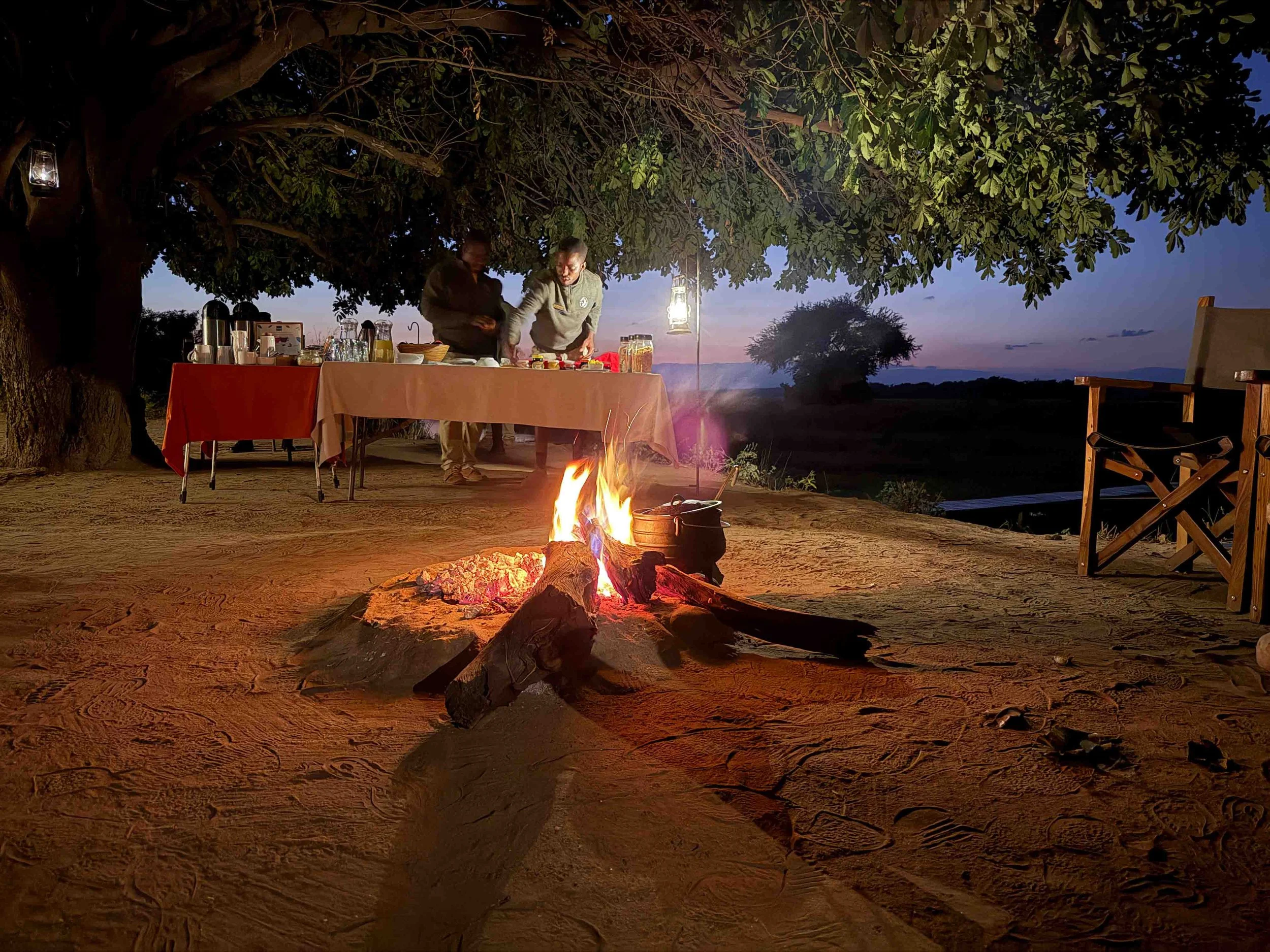 Morning coffee around the campfire at Chula Island Zambia