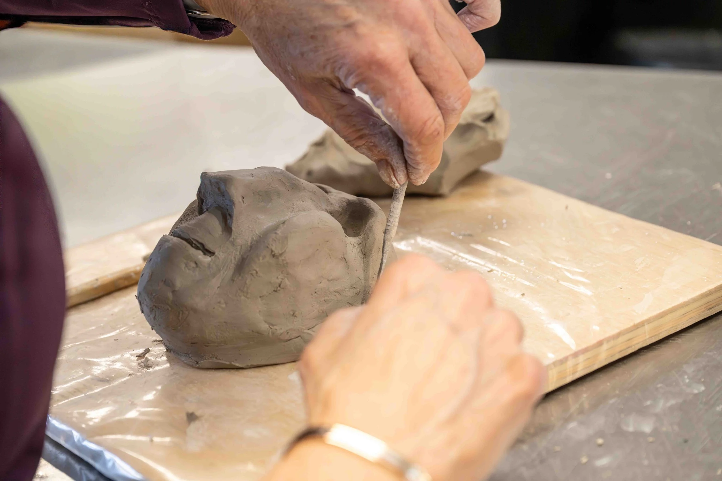 Fashioning a face from clay