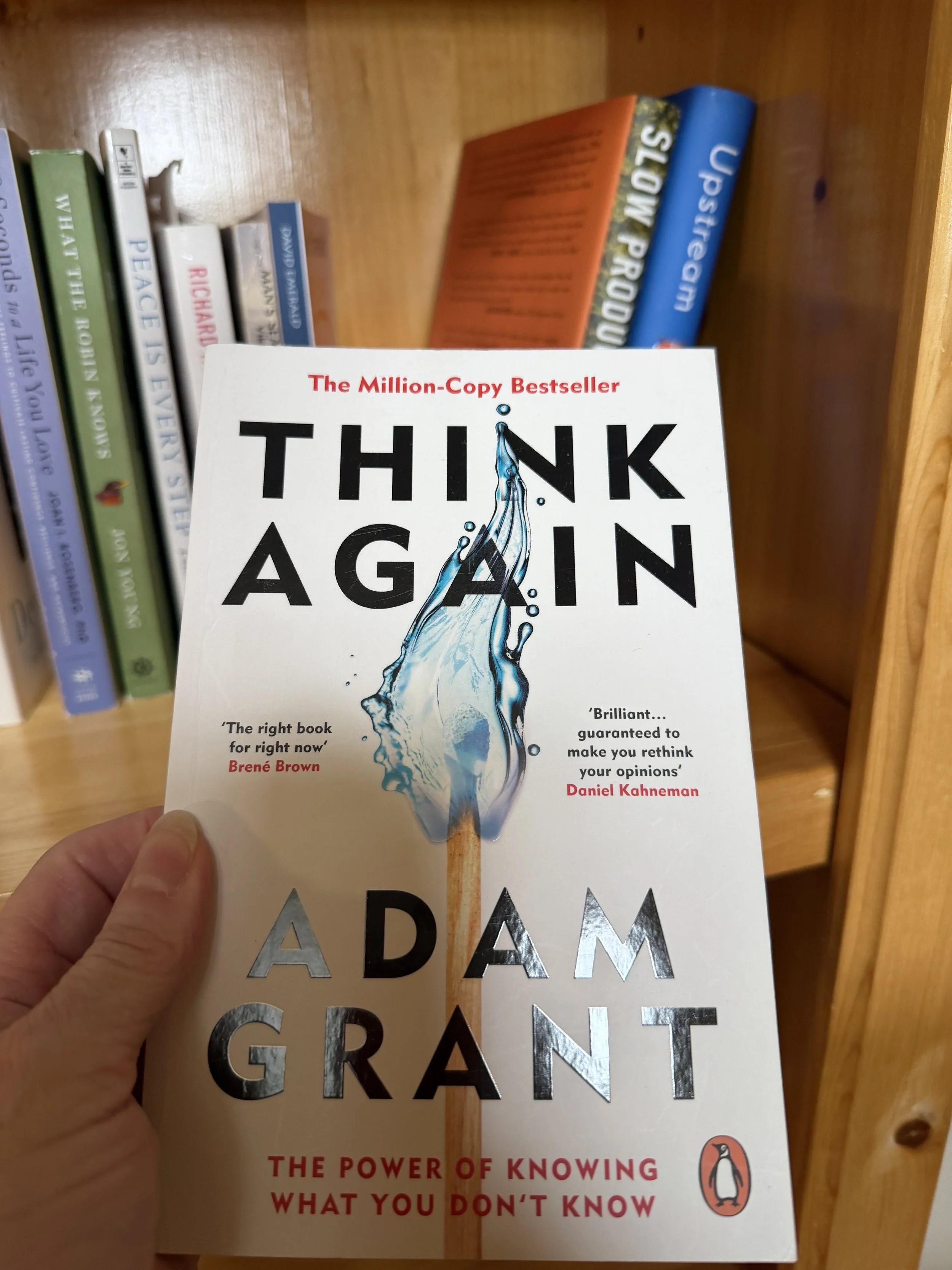 A book titled Think Again - Adam Grant