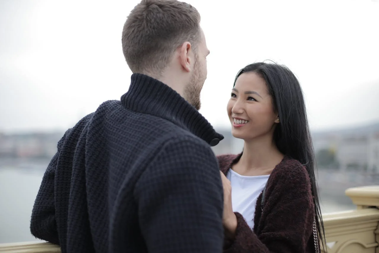 happy-couple-standing-on-the-bridge