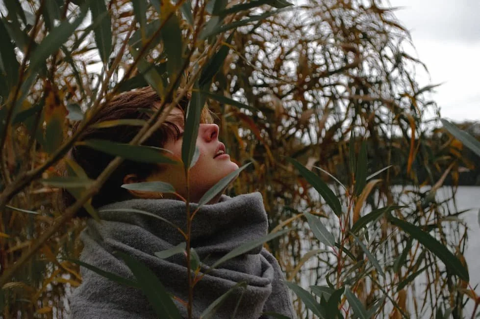 woman-standing-near-tall-grass