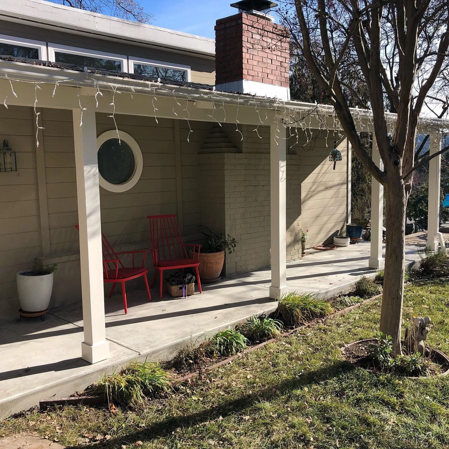 A freshly poured new concrete front porch for this client. The original was cracked and warped. The right side of the overhang sagged a good two inches, so I lifted the structure and replaced the wooden posts. Minimal, simple and clean. &mdash;Swipe 
