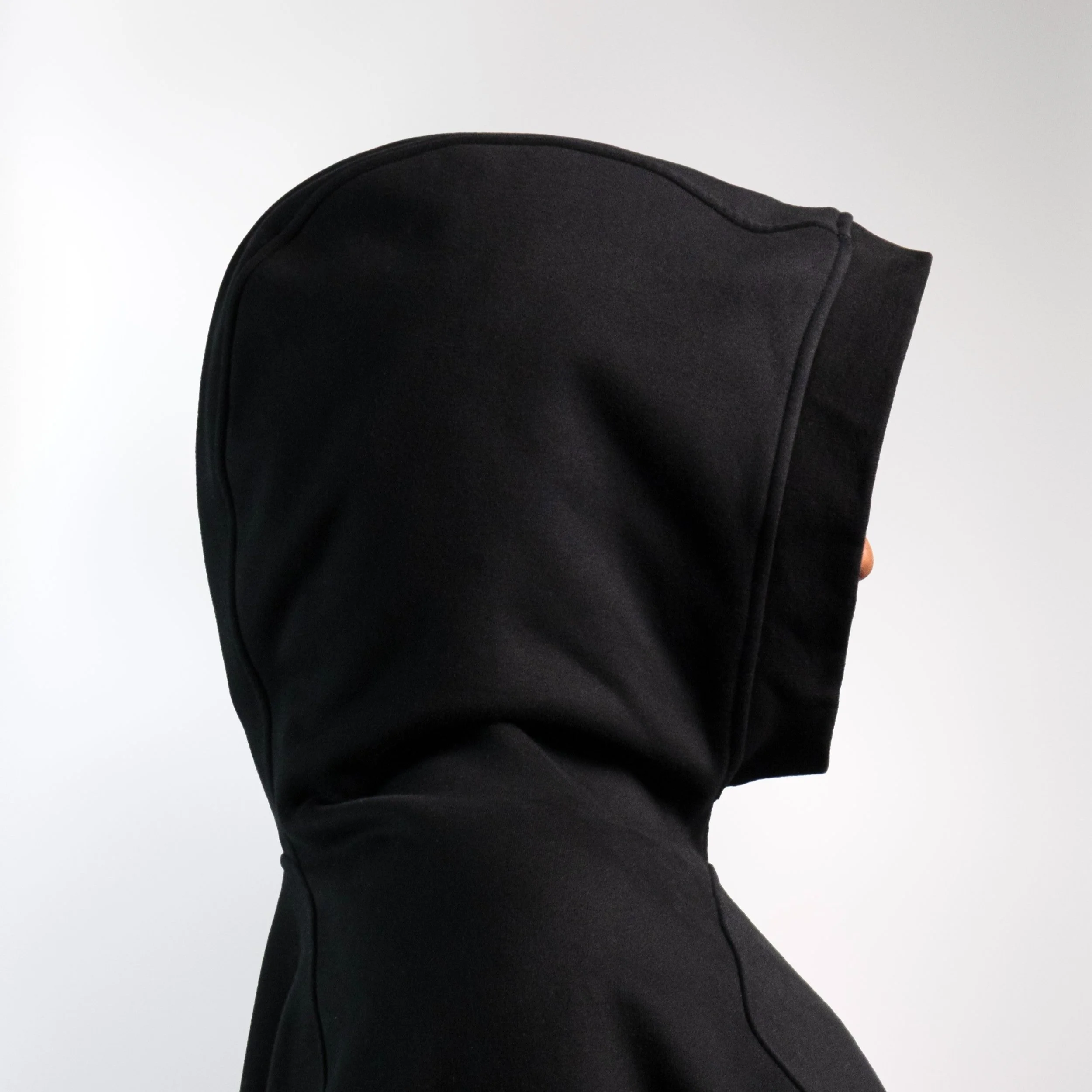 Black oversized unisex hoodie with extra large hood and unique kangaroo pocket