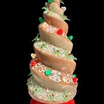 Spiral shaped Christmas tree decorated with gingerbread  colorful glaze.  A customers beautiful handiwork.